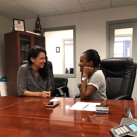 Cynthia and Andria excitedly discussing Ali Forney Center’s mission