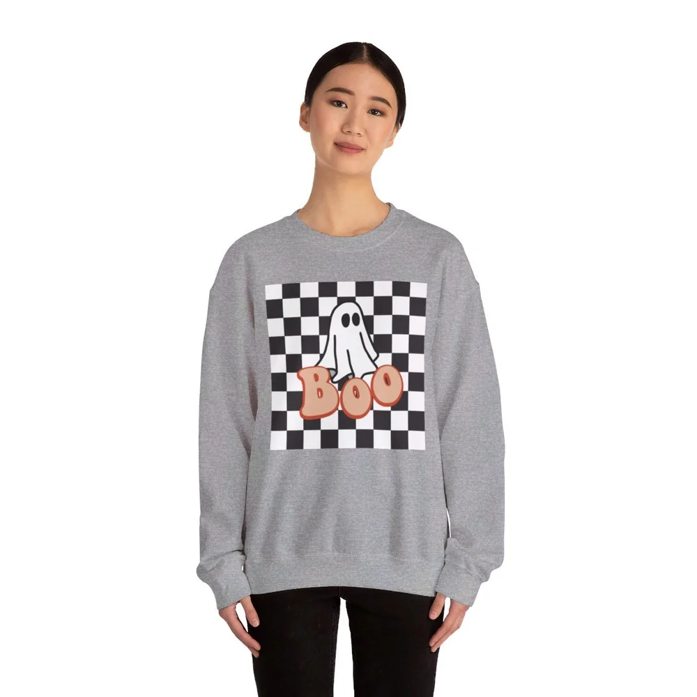 Halloween Boo Crewneck Sweatshirt with Cute Aesthetic Ghost and Black Checkered Background. Printed on a Unisex Heavy Blend Crewneck Sweatshirt The