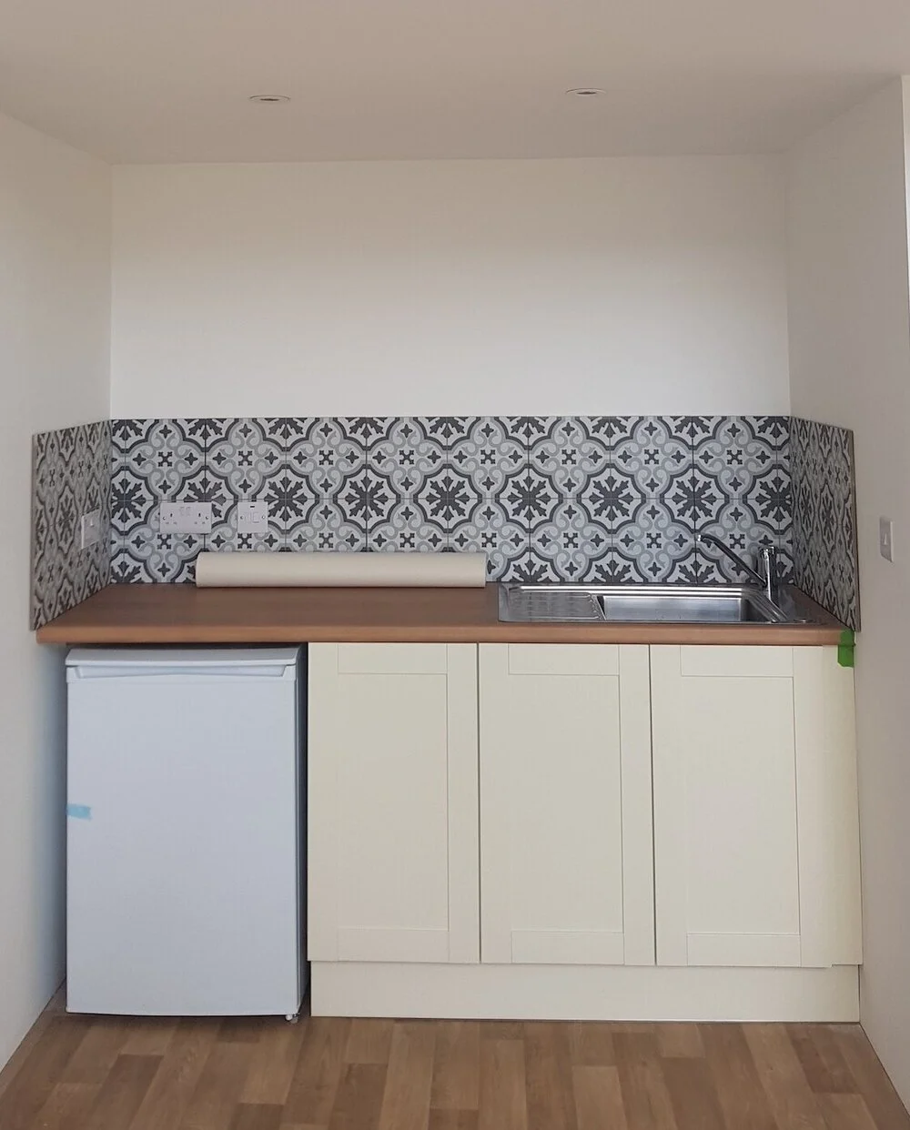 The tiny kitchenette sits in a little alcove at the back of the studio. A simple run of three cupboards, an under counter fridge with freezer compartment, and more leftover tiles from the barn renovation give it character while being functional. Perfect for essential coffee and tea while painting, and adaptable {with microwave and shelf above, added later - also cupboard knobs!} for longer term use. There’s a little hot water tank in one of the cupboards too.