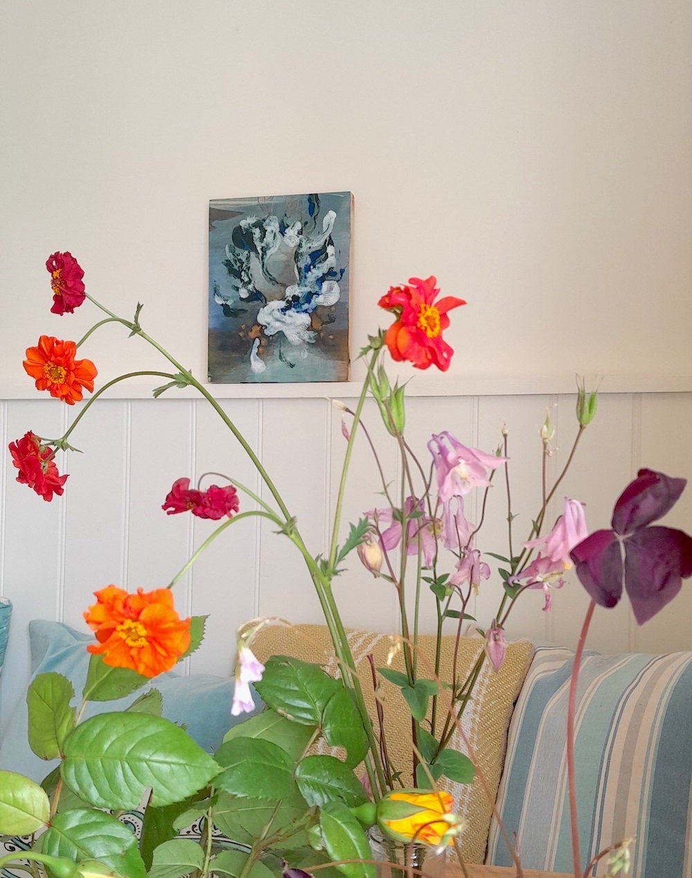 Belonging on display in the kitchen with flowers