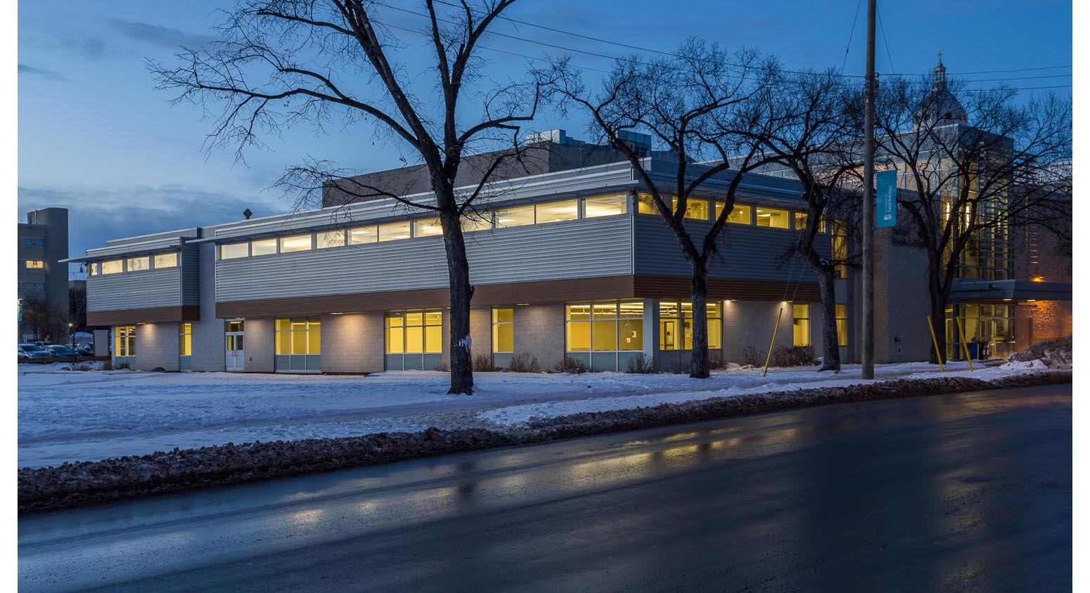  Centre de Santé Marcel A. Desautels, exterior photo of building at dusk / Photo:  Lindsay Reid  