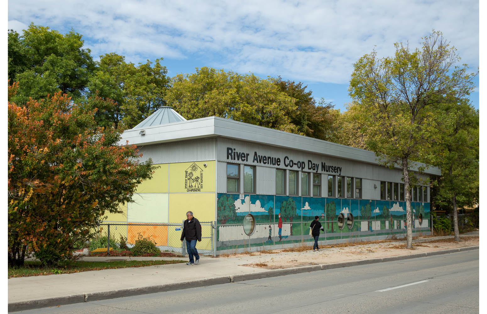  River Avenue Daycare, exterior photo of building with people walking by / Photo:  Lindsay Reid  