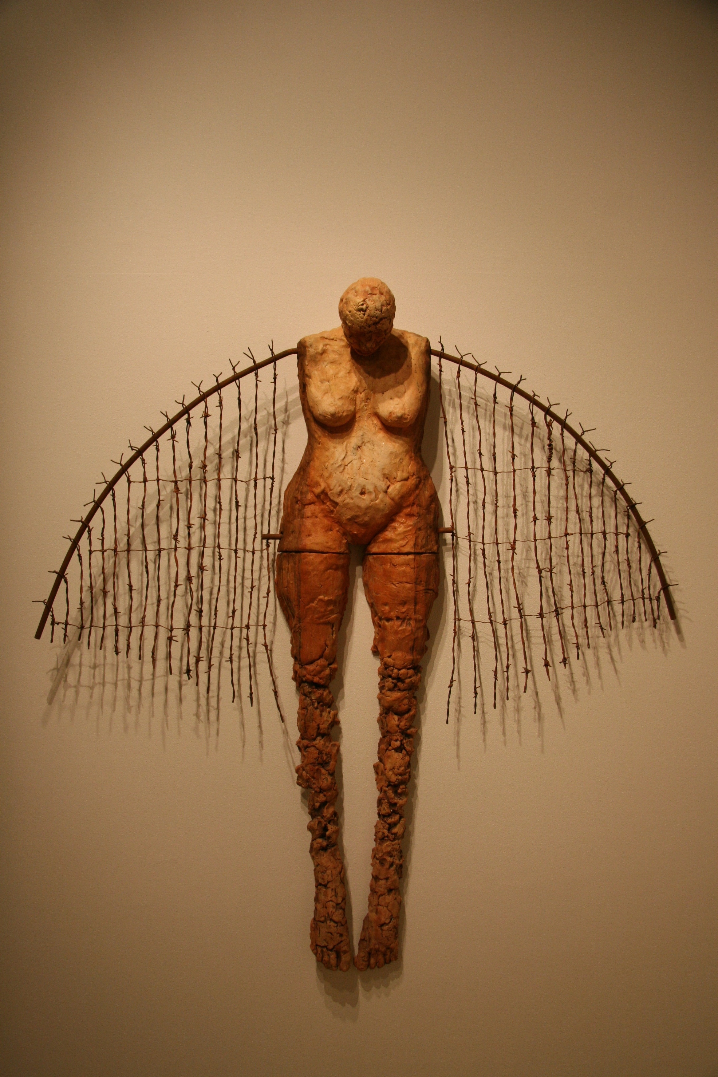 Gently and slowly rising 2001 Ceramic, steel & wire 60 x 53 x 8 The steel and barbed wire of our cages, when transformed into wings, becomes that which lifts us above the suffering and into a life of vital transcendence.