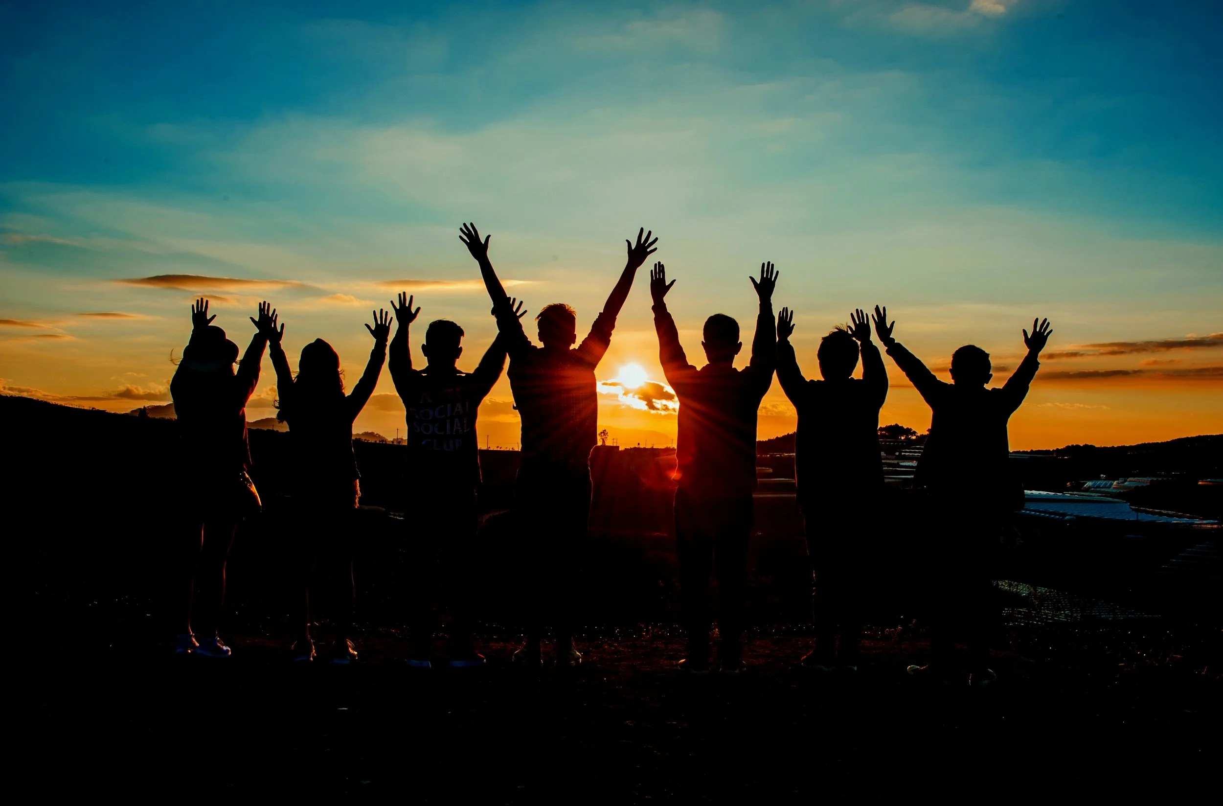 Teamwork_Sunset_Happy_Excited_Accomplishment.jpg