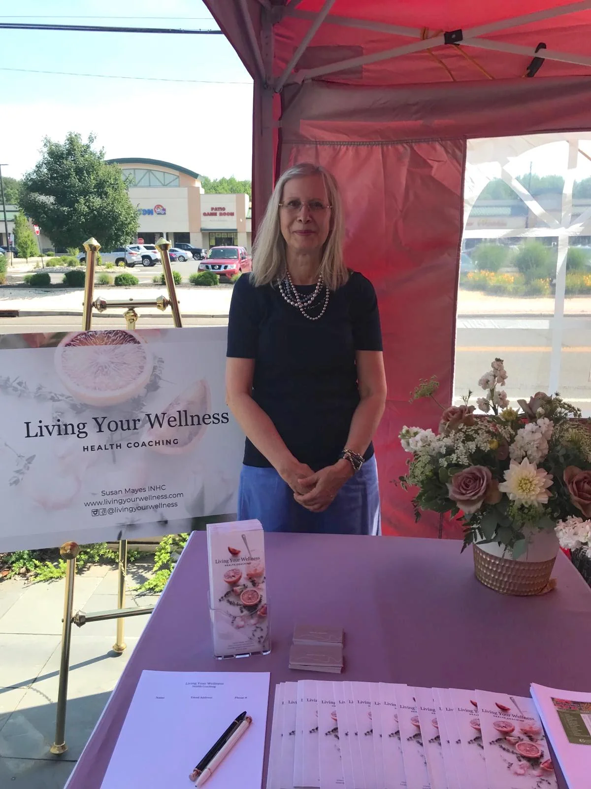 Susan with table setup.jpeg