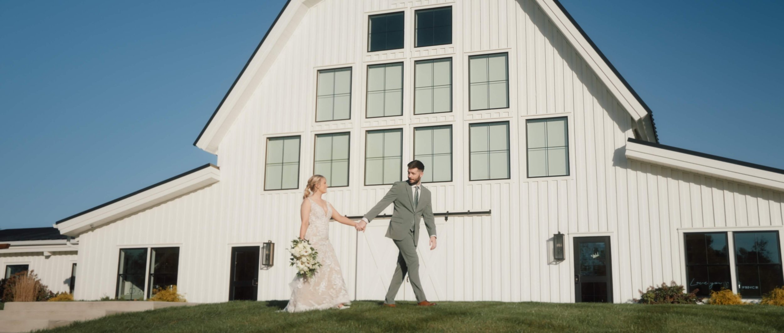 Bride and groom walking outside the Sixpence, Indianapolis wedding.jpg
