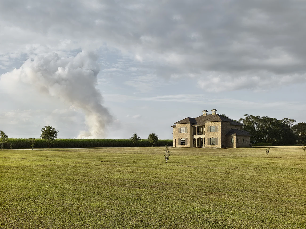 House & Burning Cane, Louisiana.jpg