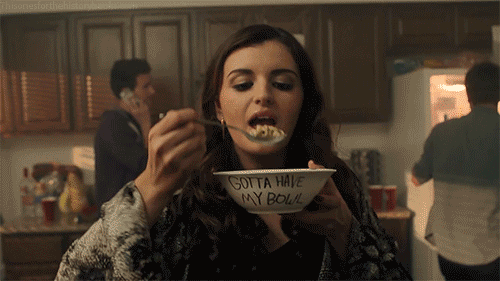 An adult Rebecca Black eats cereal from a bowl marked, "GOTTA HAVE MY BOWL."