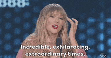 GIF of Taylor Swift making an acceptance speech, saying "Incredible, exhilarating, extraordinary times."