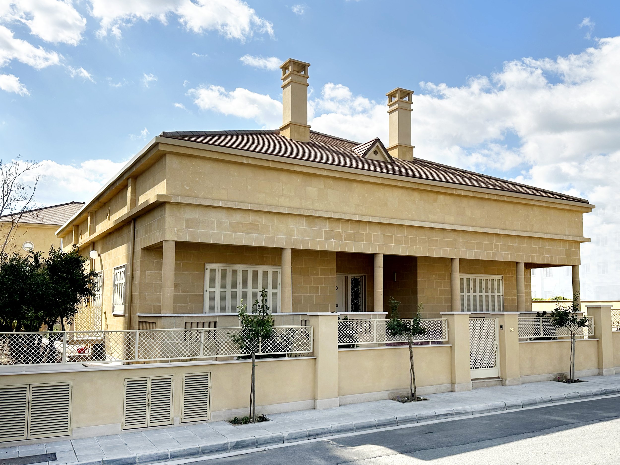villa renovation with limestone façade and vertical extension