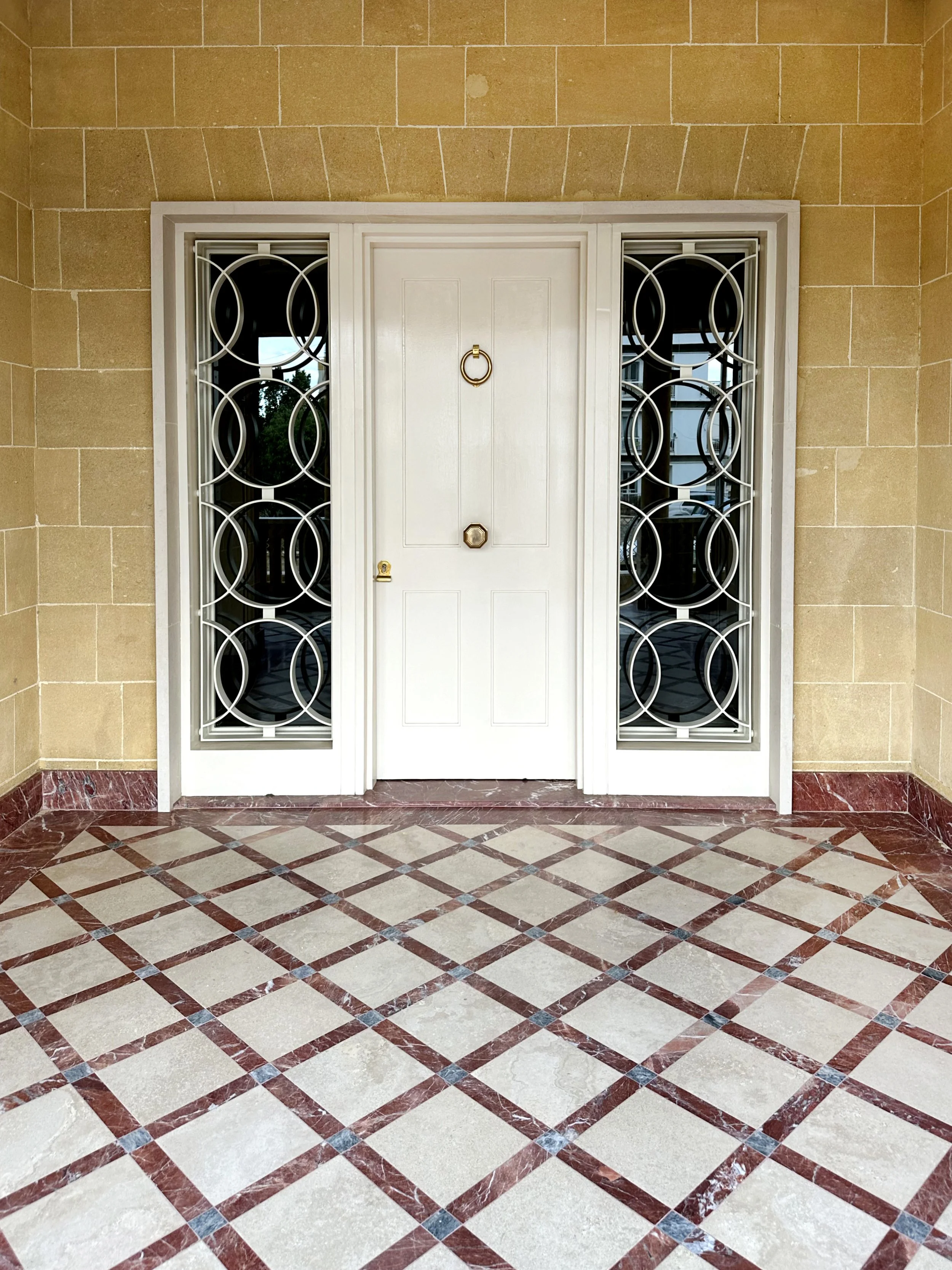luxury-mediterranean-villa-entrance-custom-metalwork-double-door.jpg