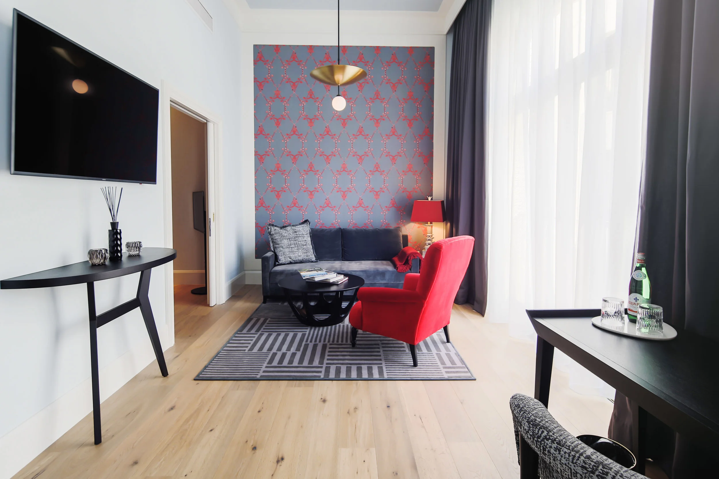 Apartment suite with Morning Glory wallpaper in custom Red