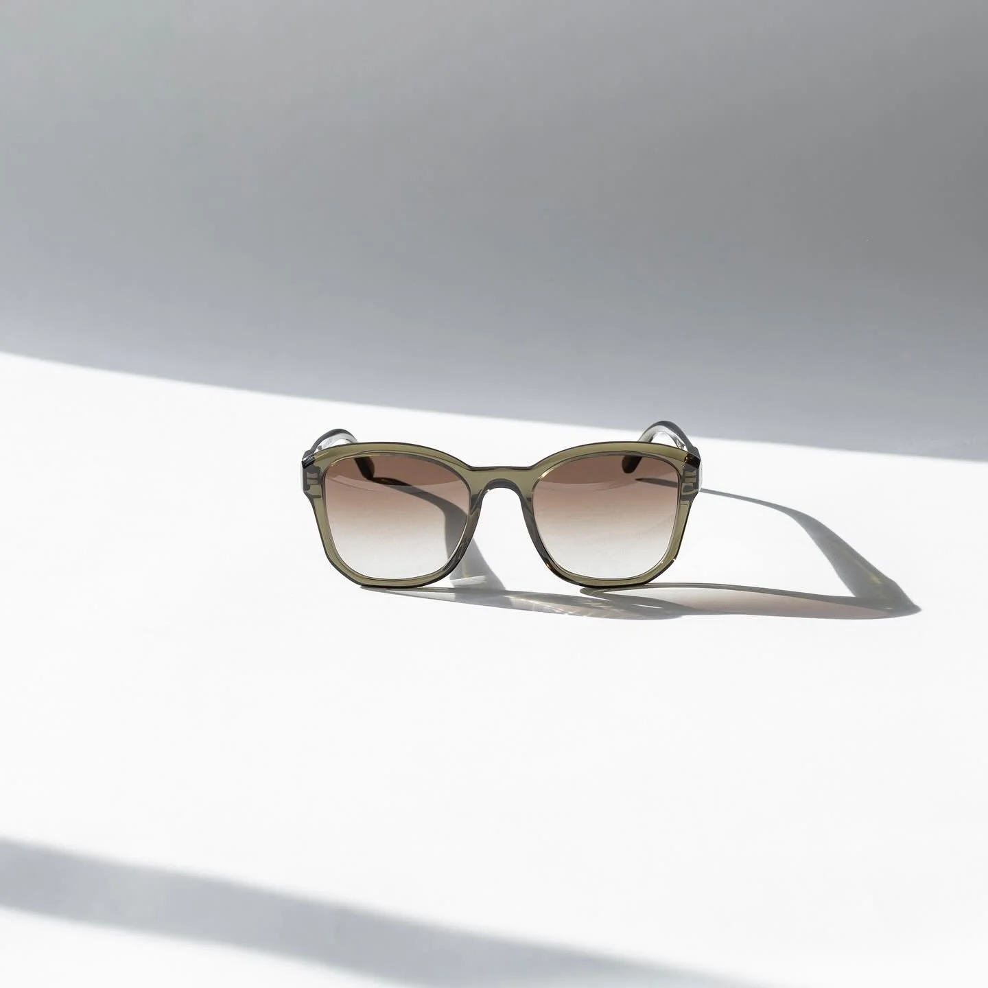 BQE Turtle // 
Inspired by the revered, auspicious turtle of Japanese tradition&mdash;a symbol of longevity, resilience, and quiet wisdom&mdash;this olive-tinted frame embodies lasting grace. With a category 2 gradient brown lens that fades gently fr