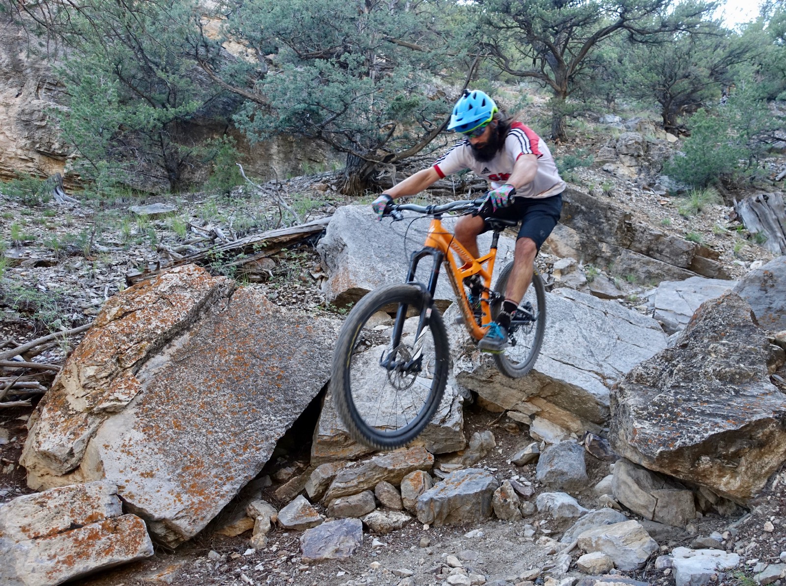 Airing off a drop in the technical Waterfall section of the Cottonwood trail. Rider: The Singletrack Sampler. Photo: Greg Heil.