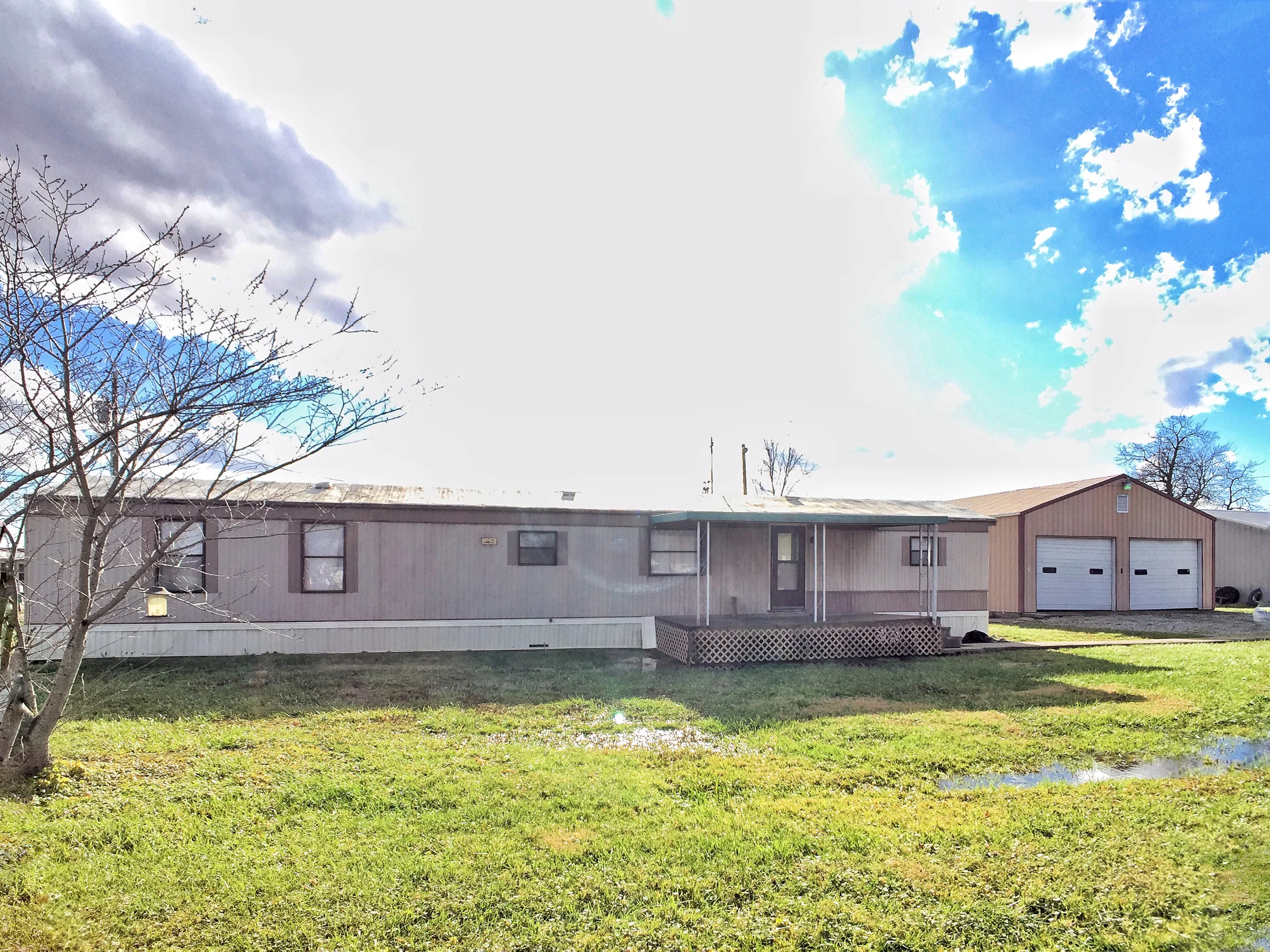 SOLD !! MOBILE HOME PLUS A HUGE DETACHED POLE BARN GARAGE !!