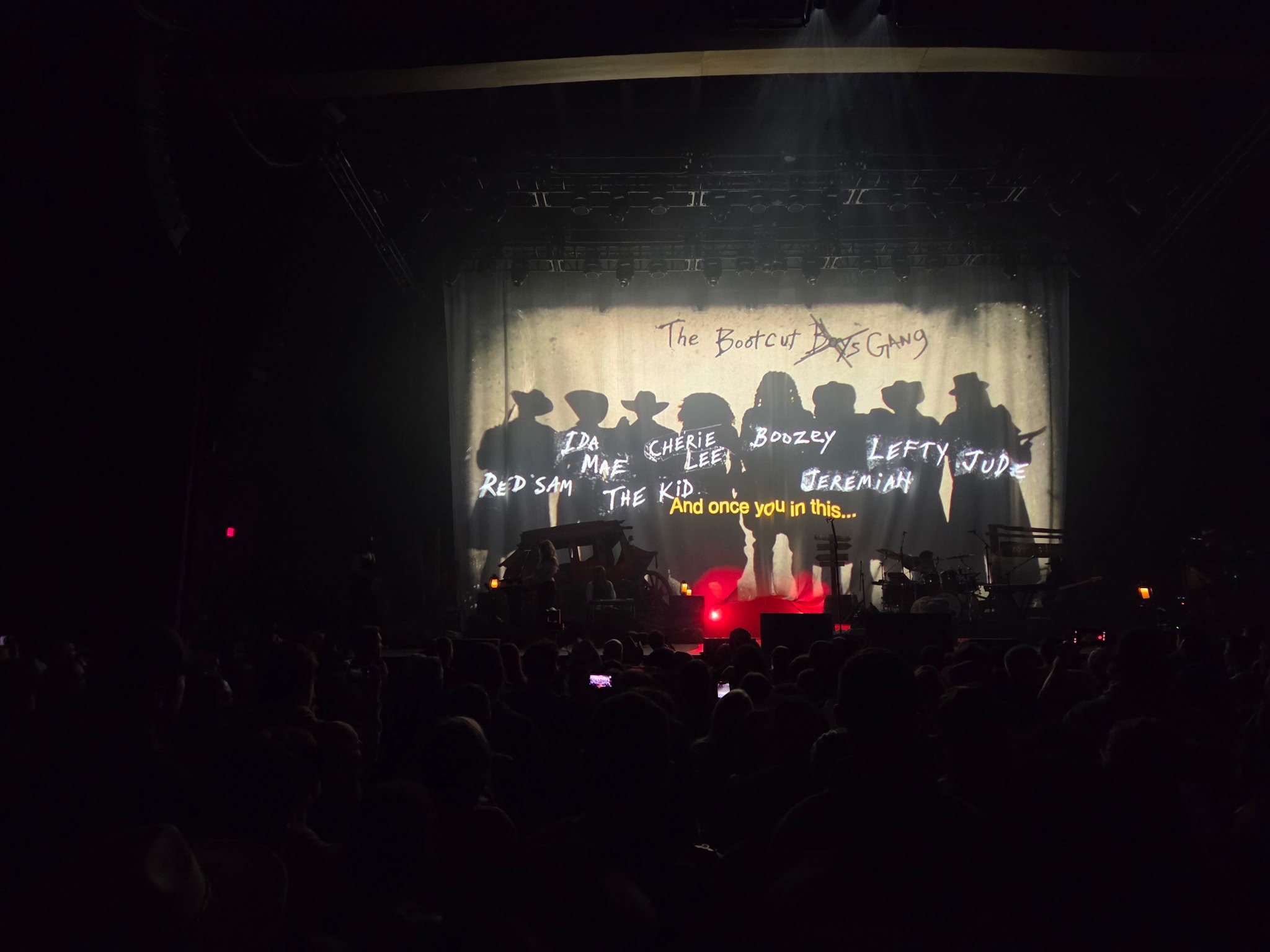 Bootcut Gang Western-themed stage projection during Shaboozey's Outlaws Never Die Tour at MGM Music Hall at Fenway.