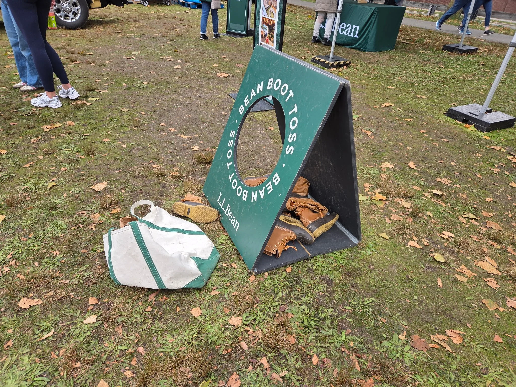 Visitors enjoy an L.L.Bean boot-toss activity at the Head of the Charles festival. Photo: GoBoston.