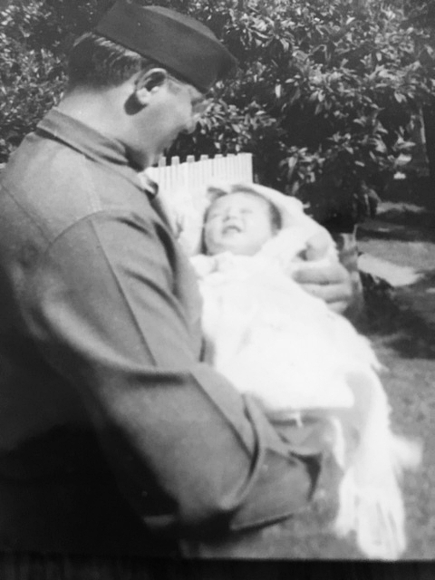 soldier holding baby.JPG
