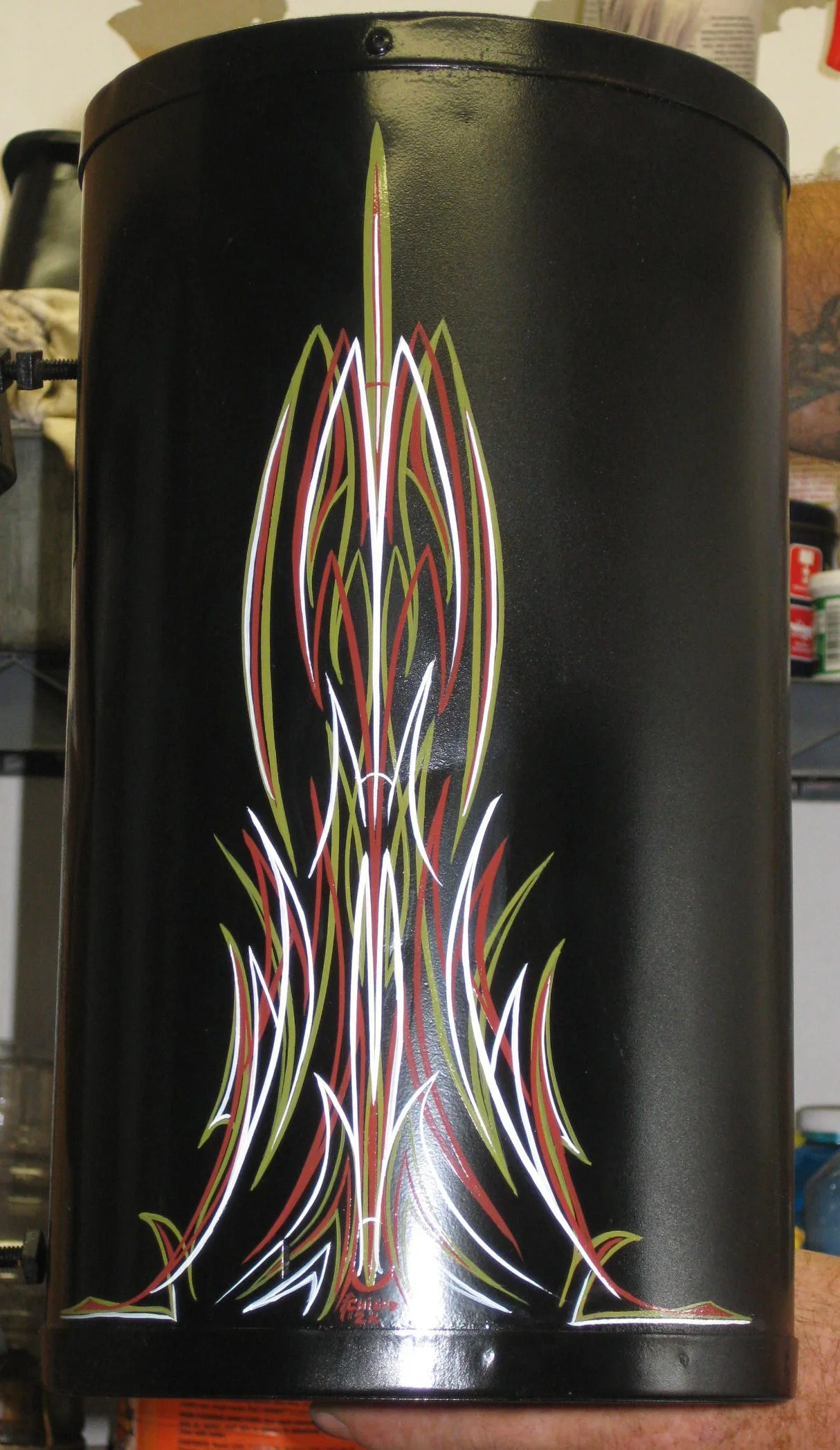  Car A/C from the forties. You fill with water and it hangs outside the window. As you drive, air blows through it and into the car. 