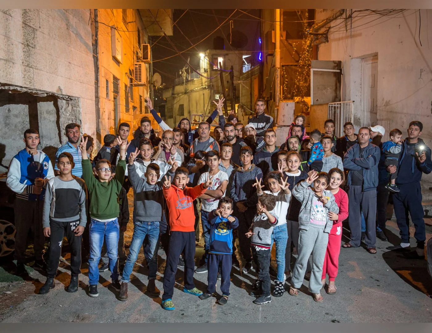 Just last month, Israeli courts rules that 700 Palestinians living in Silwan will be evicted by Elad and their allies to make room for this Jewish settlement. Birthright participants don’t hear that story — or any other stories of the realities of Occupation for millions of Palestinians living in East Jerusalem, the West Bank, and Gaza. This images shows residents of Silwan. Image: Emil Salman