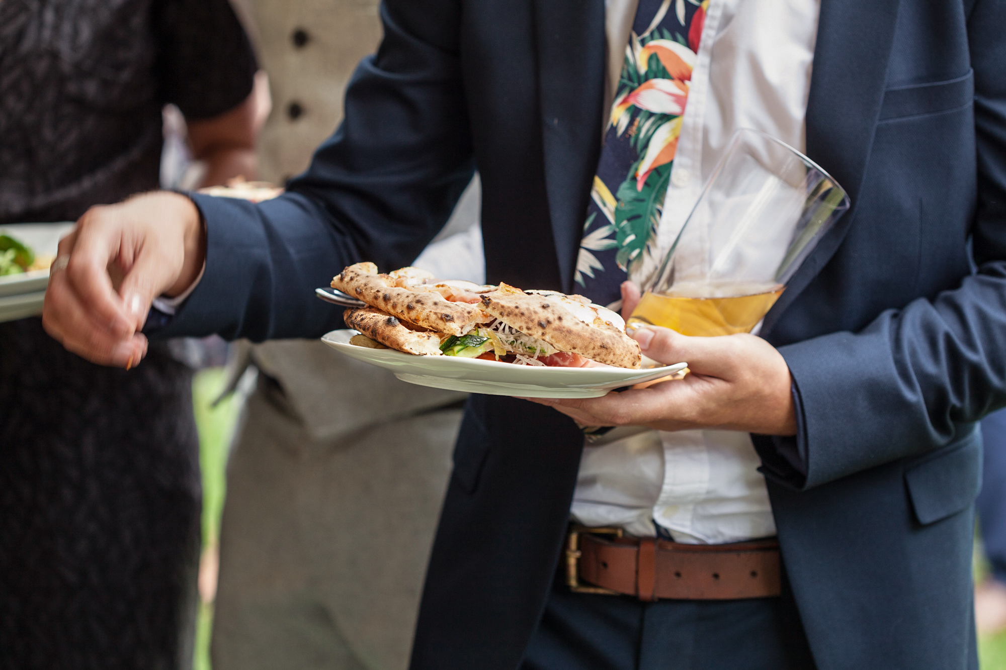 We call this one the perfectly performed single-handed personal pizza pile incl. precariously positioned pint pose.jpg