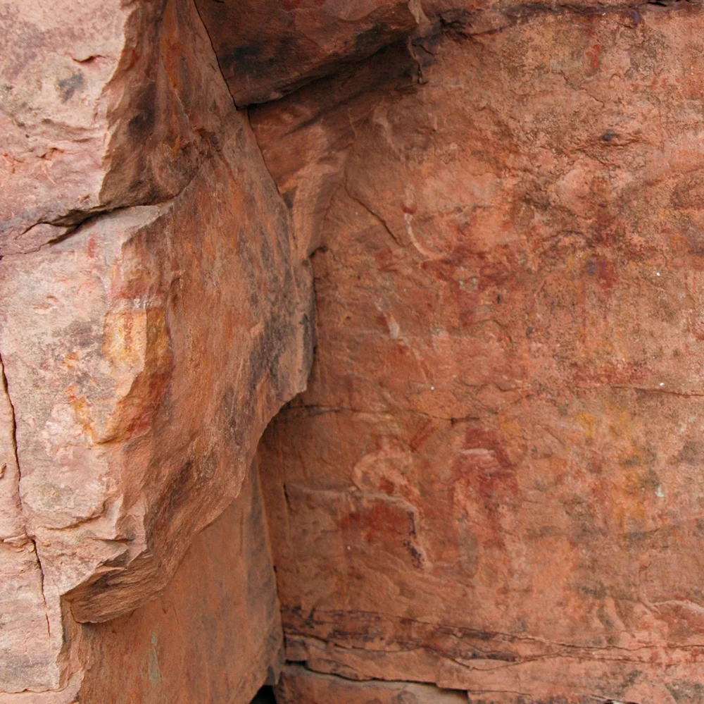 Dancing Star Man (Middle-right), White Man (upper-middle), Mask on Corner of Rock (middle-left)