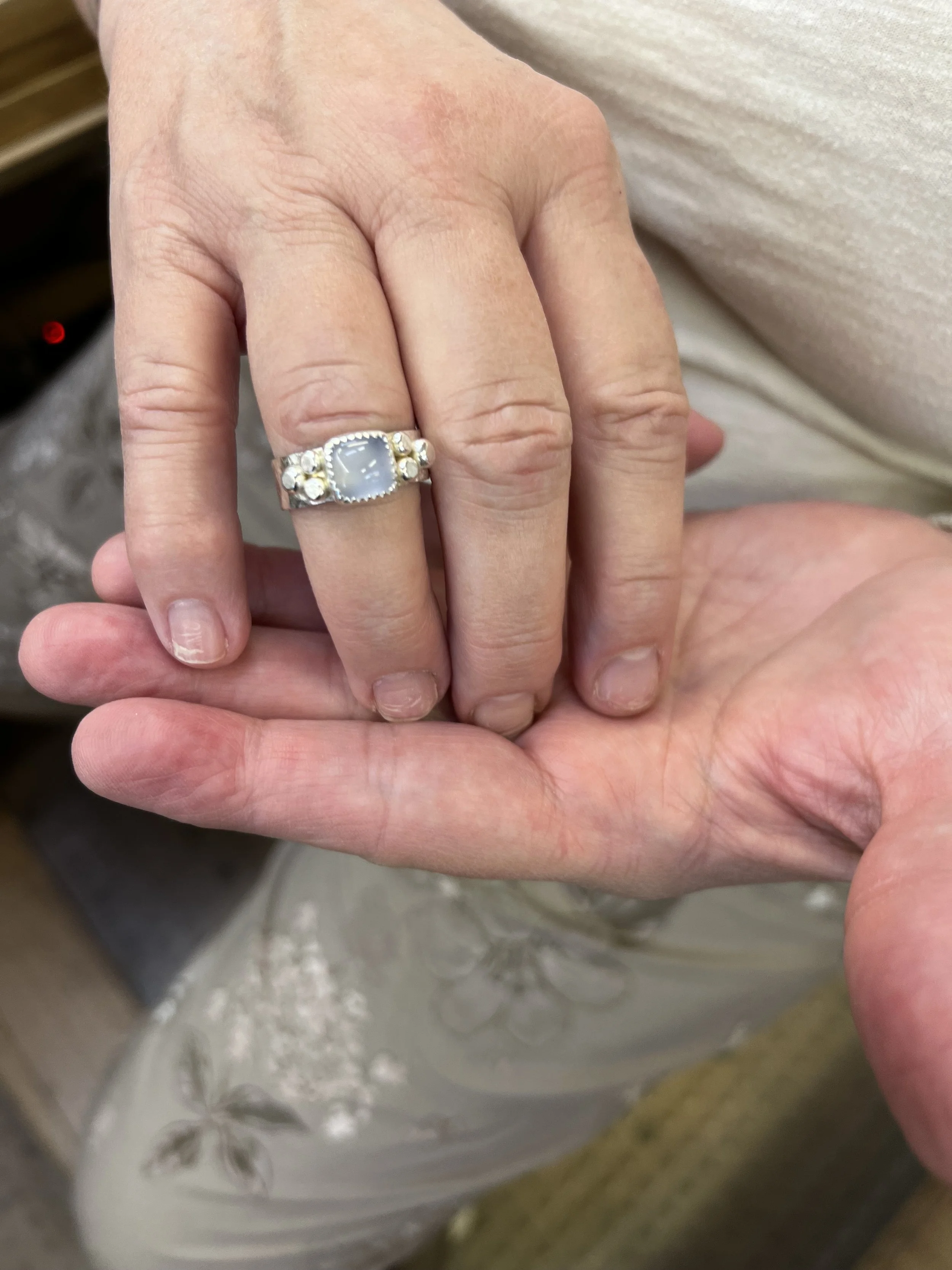 Finished keepsake rings made by students in a Meltdown Studio silversmithing class