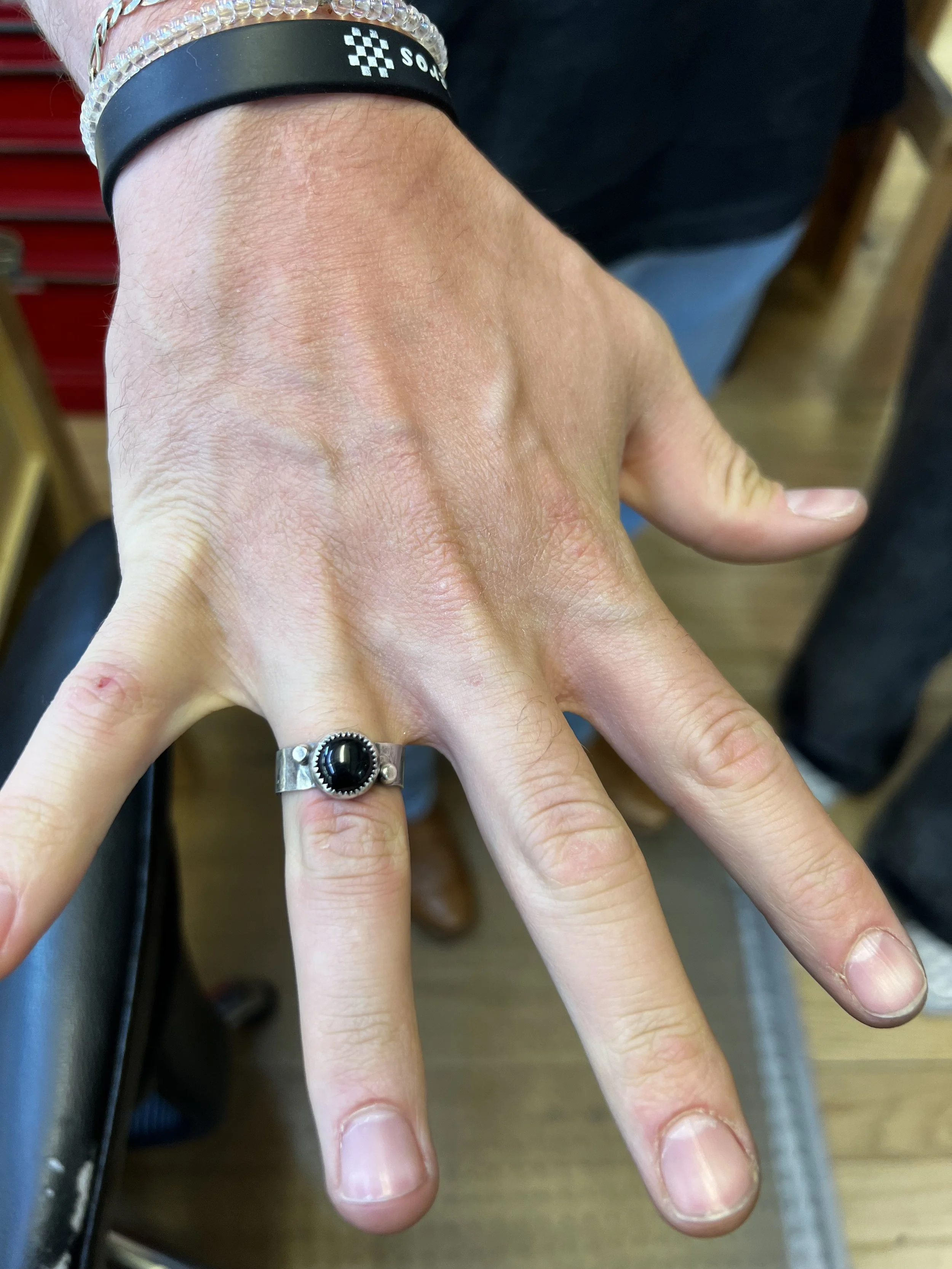 Student-made keepsake rings displayed after a jewelry making class at Meltdown Studio