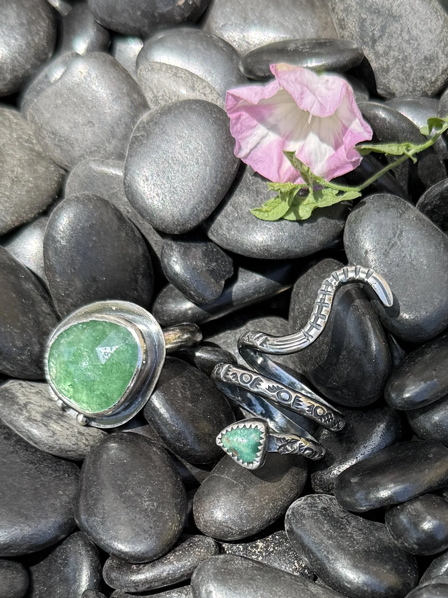 Handcrafted sterling silver ring with rose cut stone made in a jewelry class in Albuquerque
