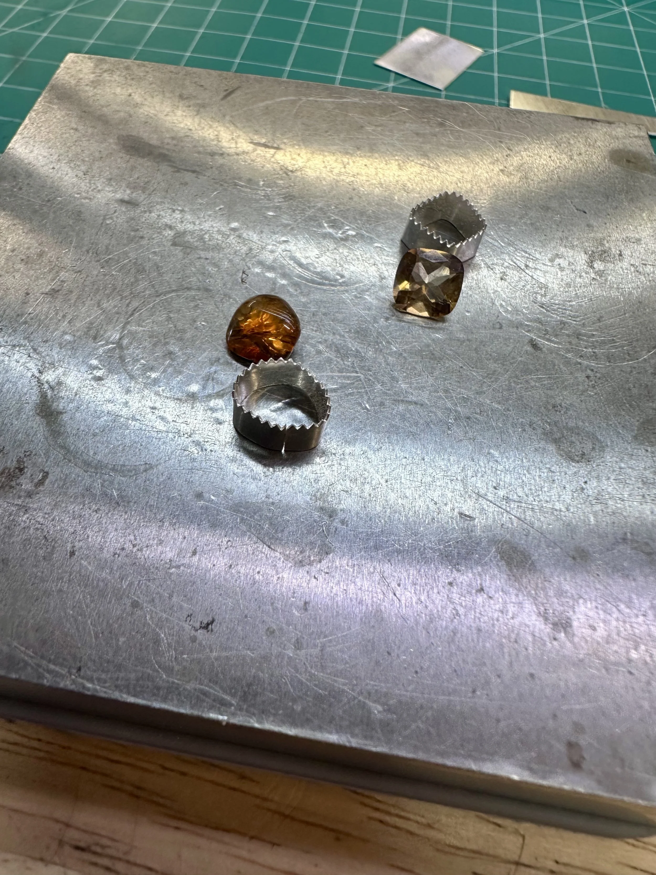 Sterling silver wrap rings with tourmaline stones in progress during a silversmithing class at Meltdown Studio