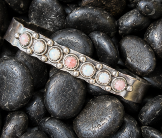 Multi stone turquoise cuff bracelet on black stones from a jewelry making class in Albuquerque