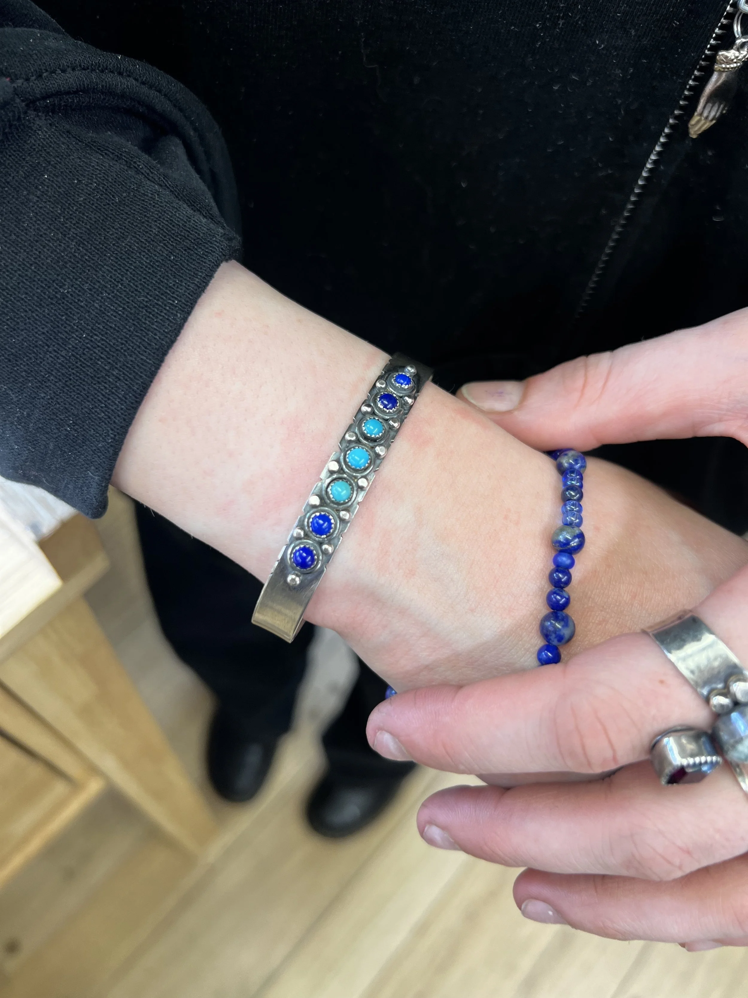 Finished turquoise cuff bracelet being worn from a jewelry making class in Albuquerque