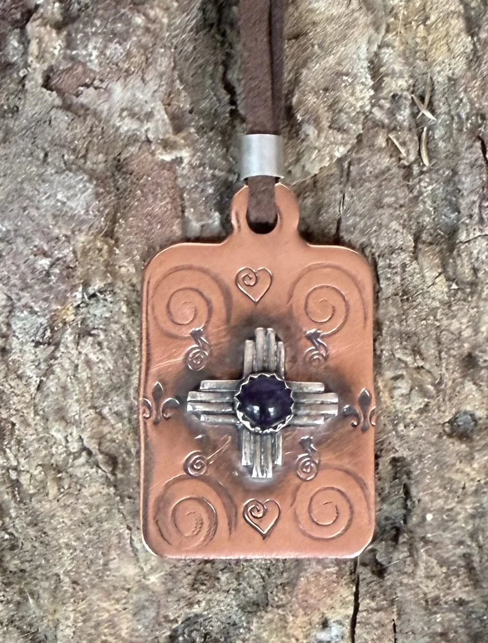 Handmade copper and silver Zia necklace with turquoise cabochon from a jewelry making class in Albuquerque.