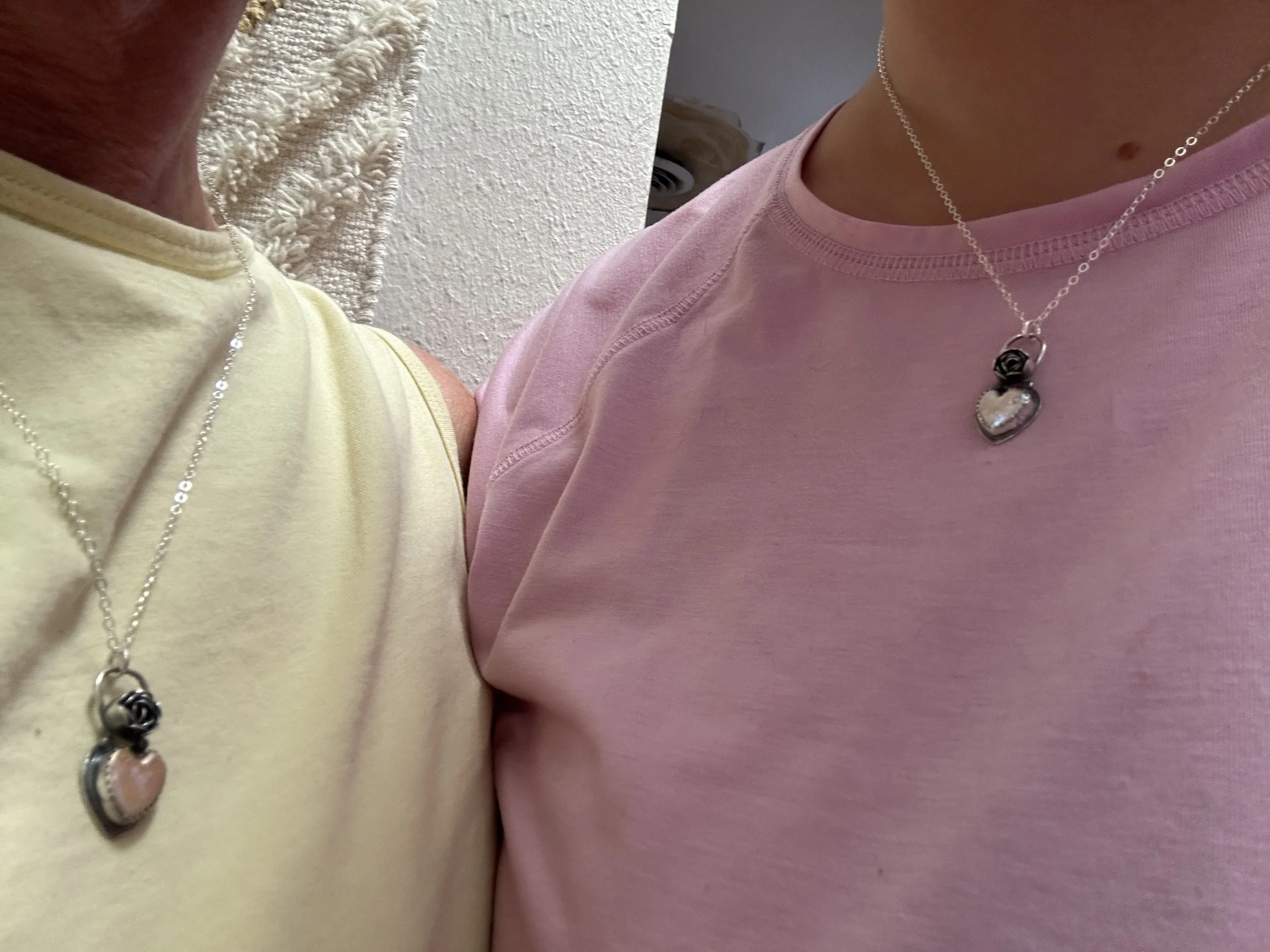Student wearing handmade sterling silver blooming heart pendant, jewelry making class Albuquerque
