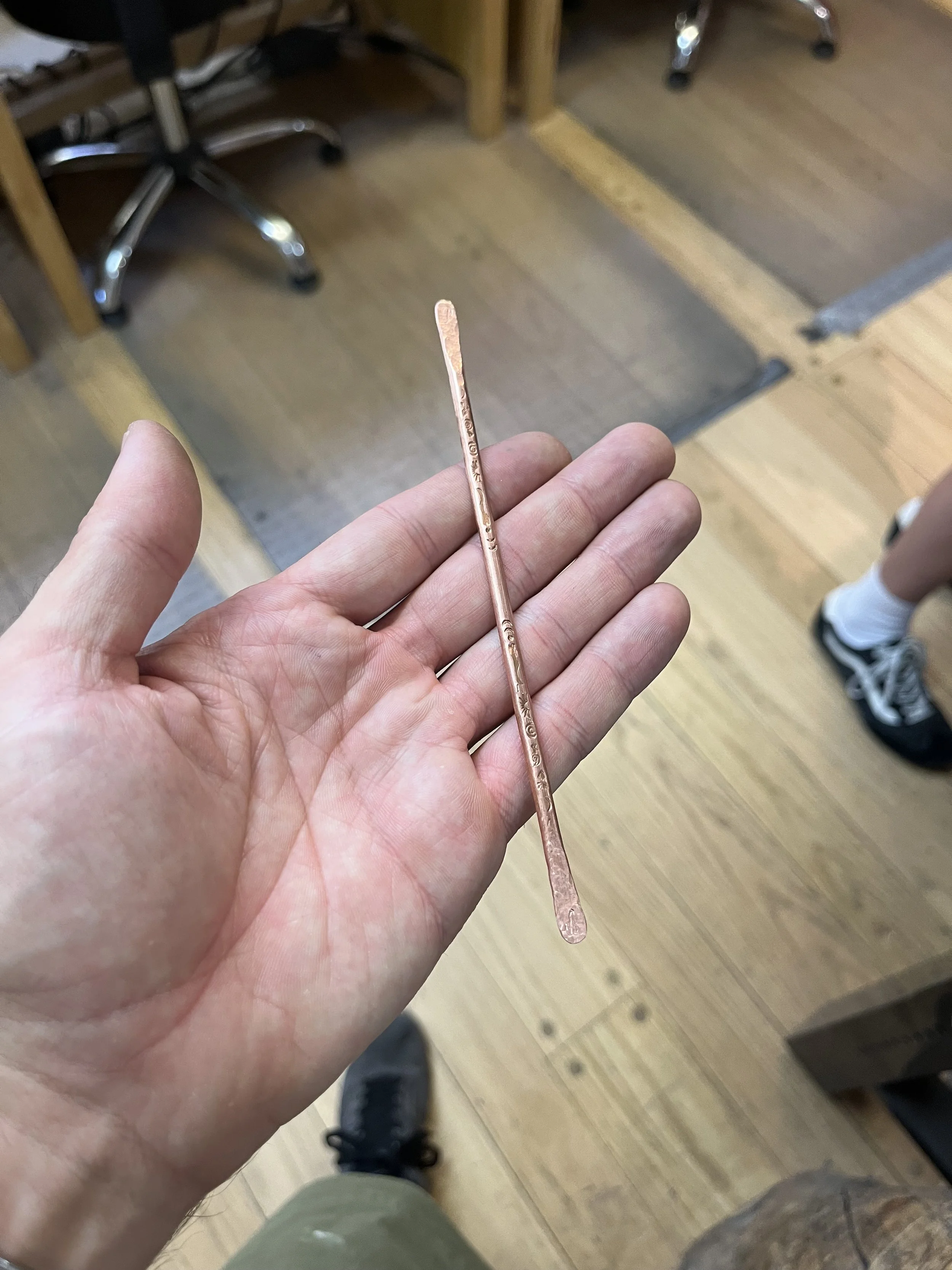 Measuring copper wire in private jewelry instruction Albuquerque