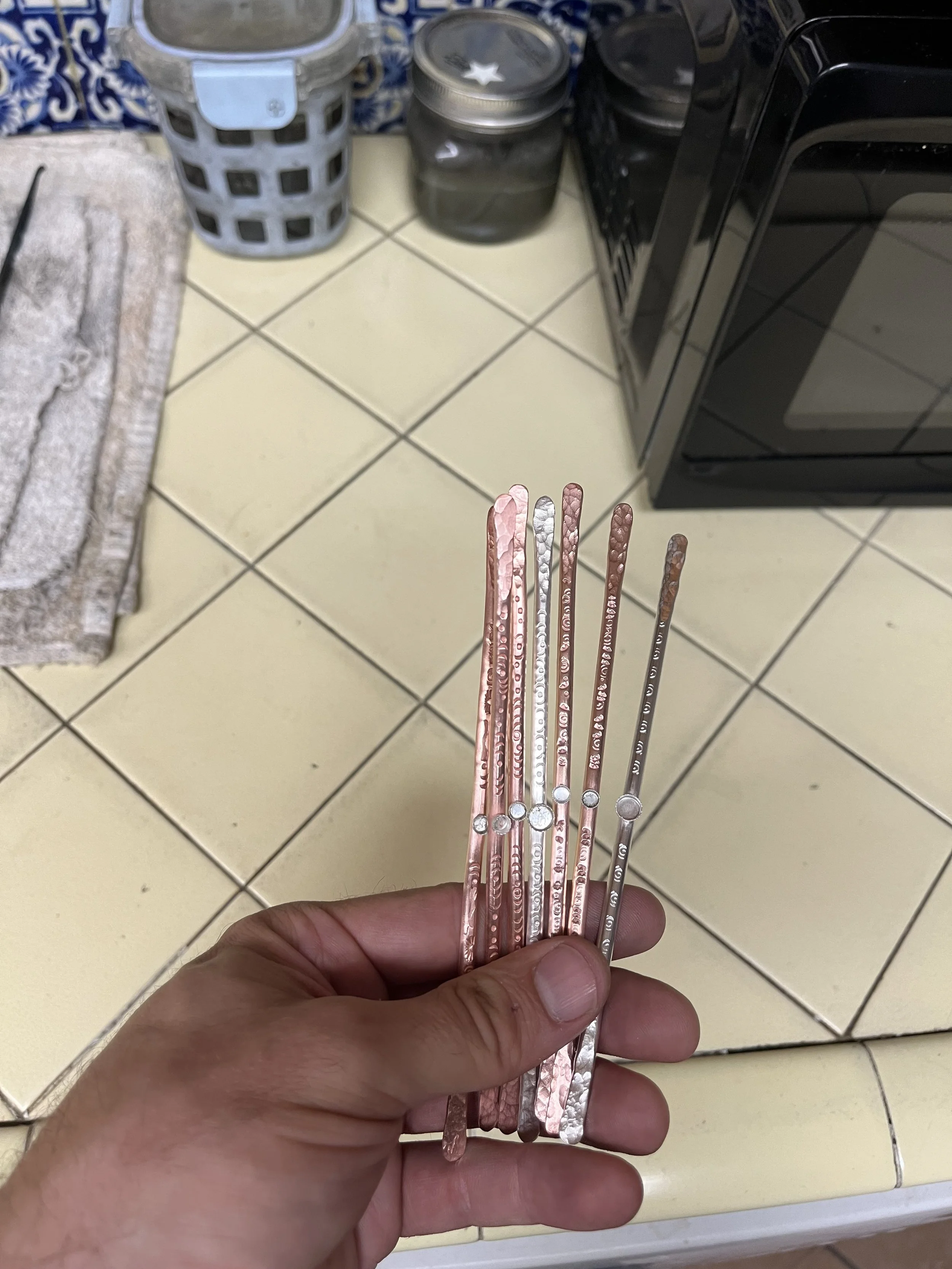 Cut copper bracelet blanks in private jewelry instruction Albuquerque
