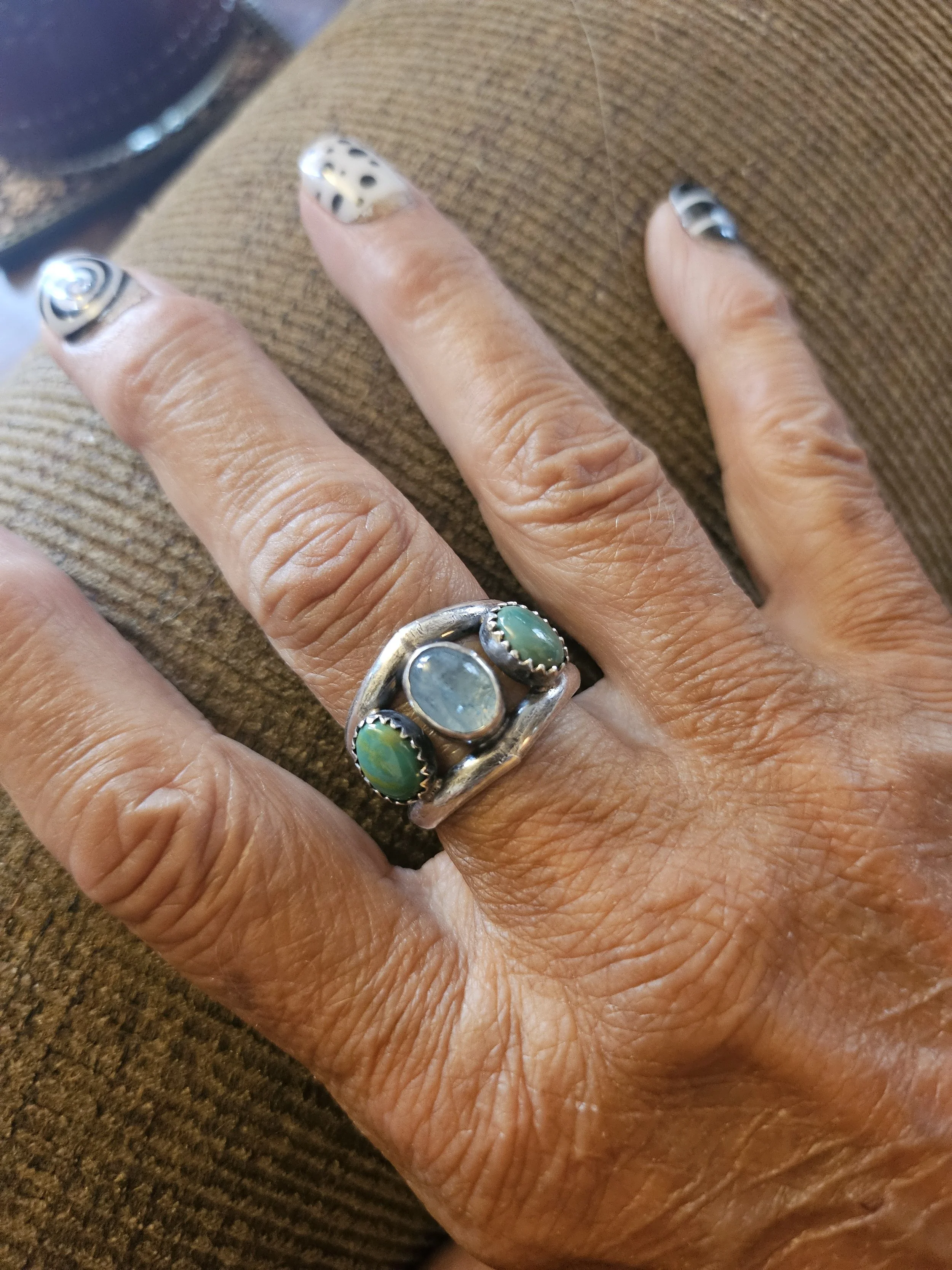 Student wearing a multi-stone ring from a jewelry making class in Albuquerque