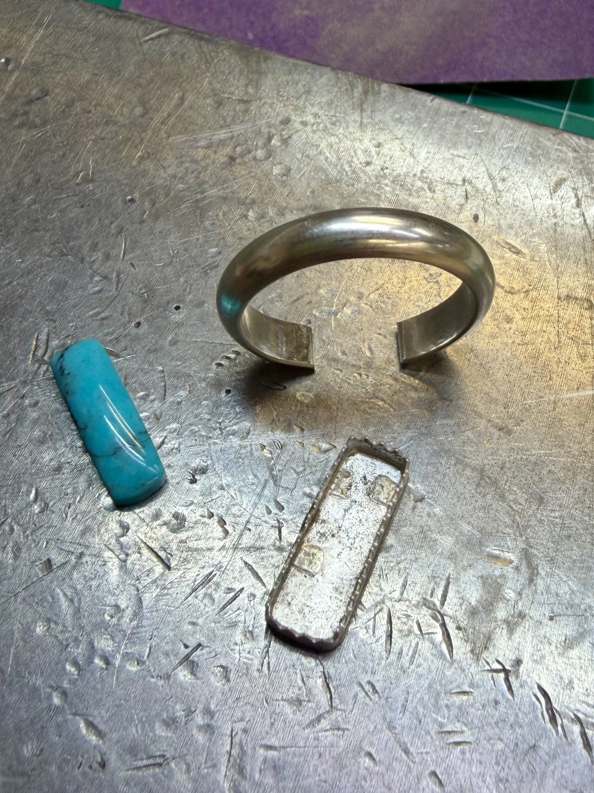 turquoise ring in Albuquerque band forming and bezel materials