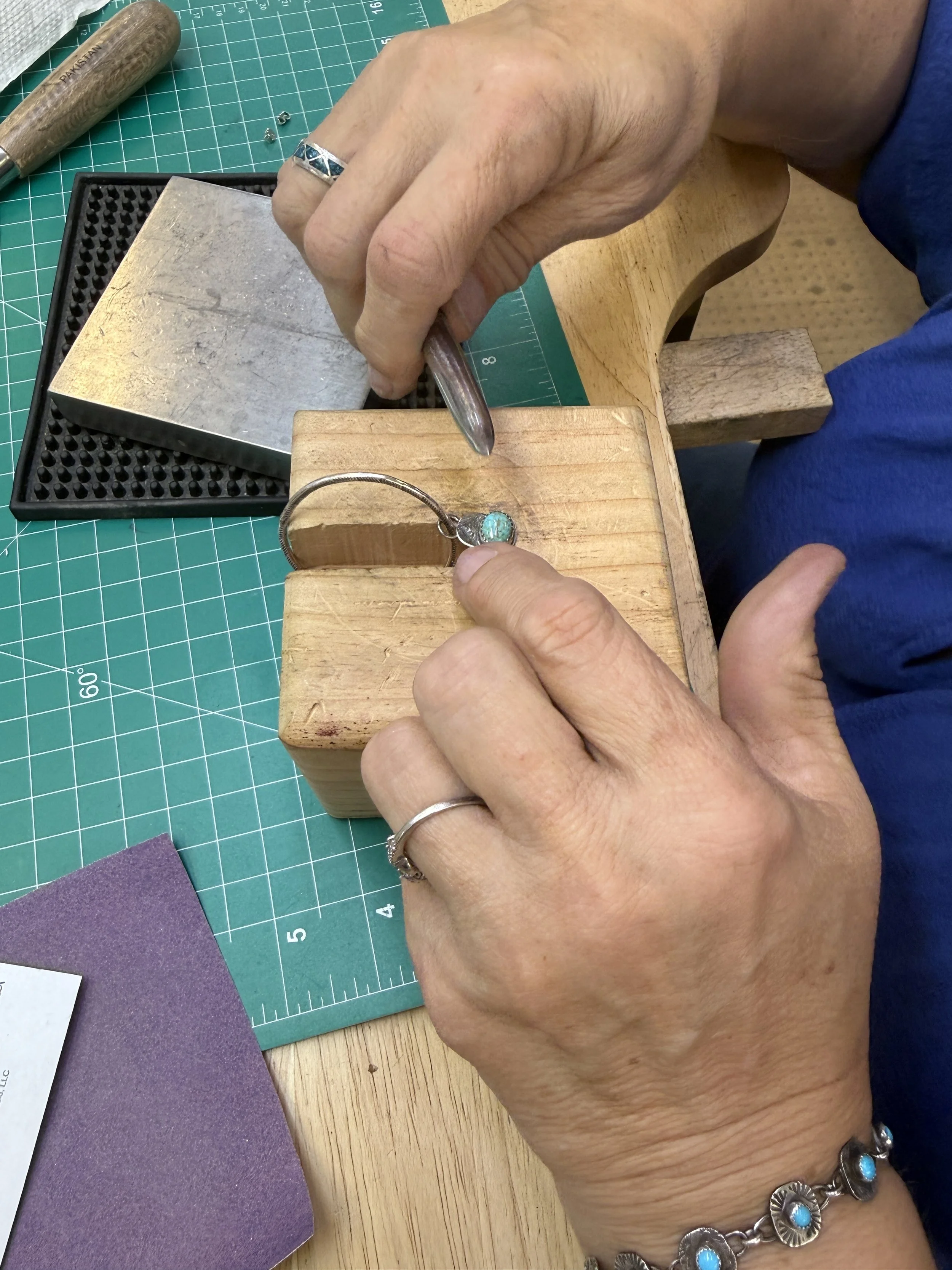 Student setting turquoise in a Jewelry Making Class in Albuquerque