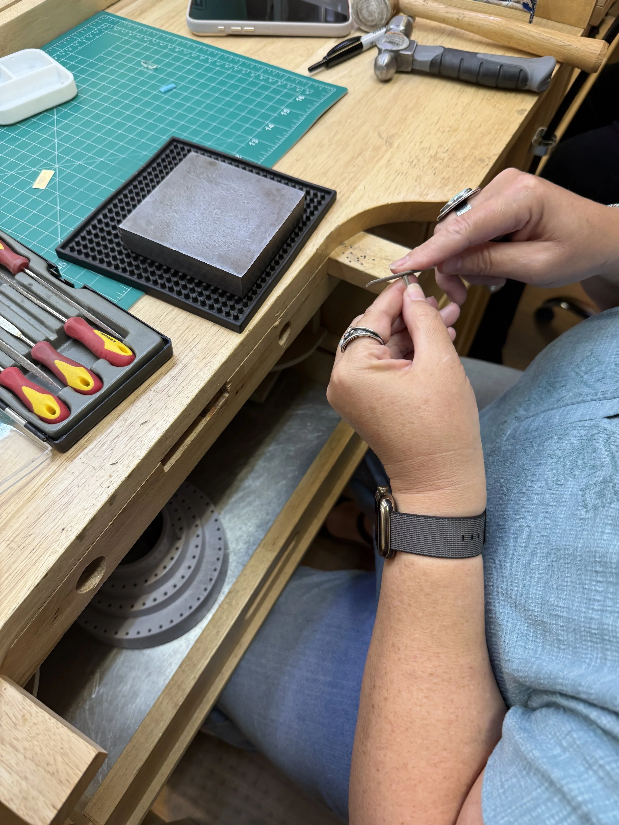 Student refining a ring in a Jewelry Making Class in Albuquerque