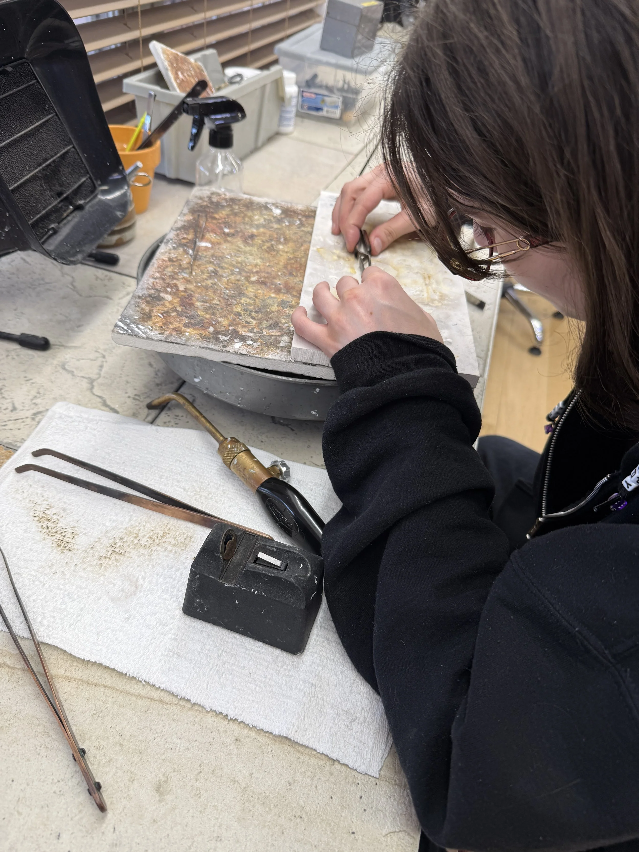 Student setting turquoise in a Jewelry Making Class in Albuquerque