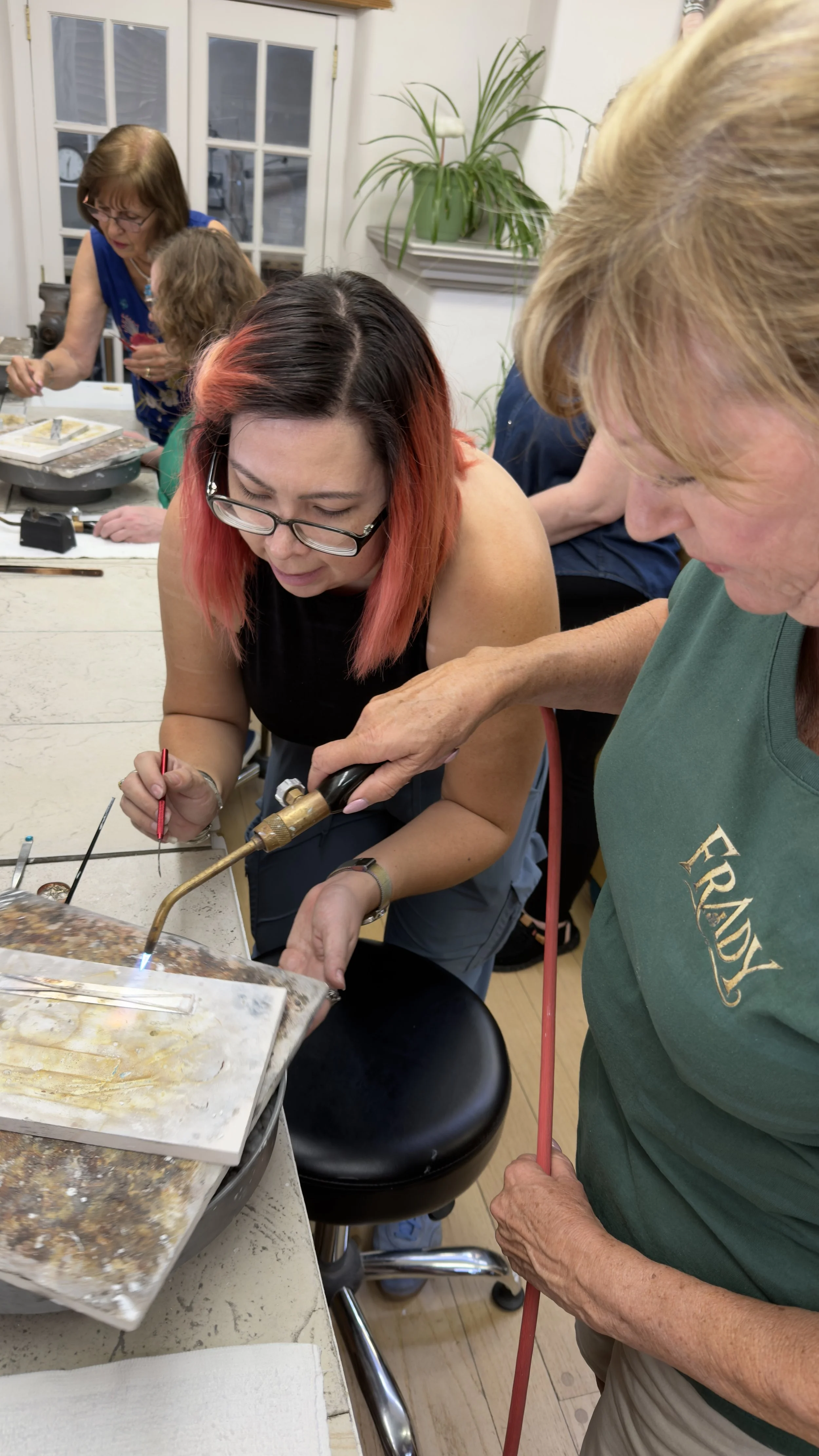 Students soldering in a Jewelry Making Class in Albuquerque