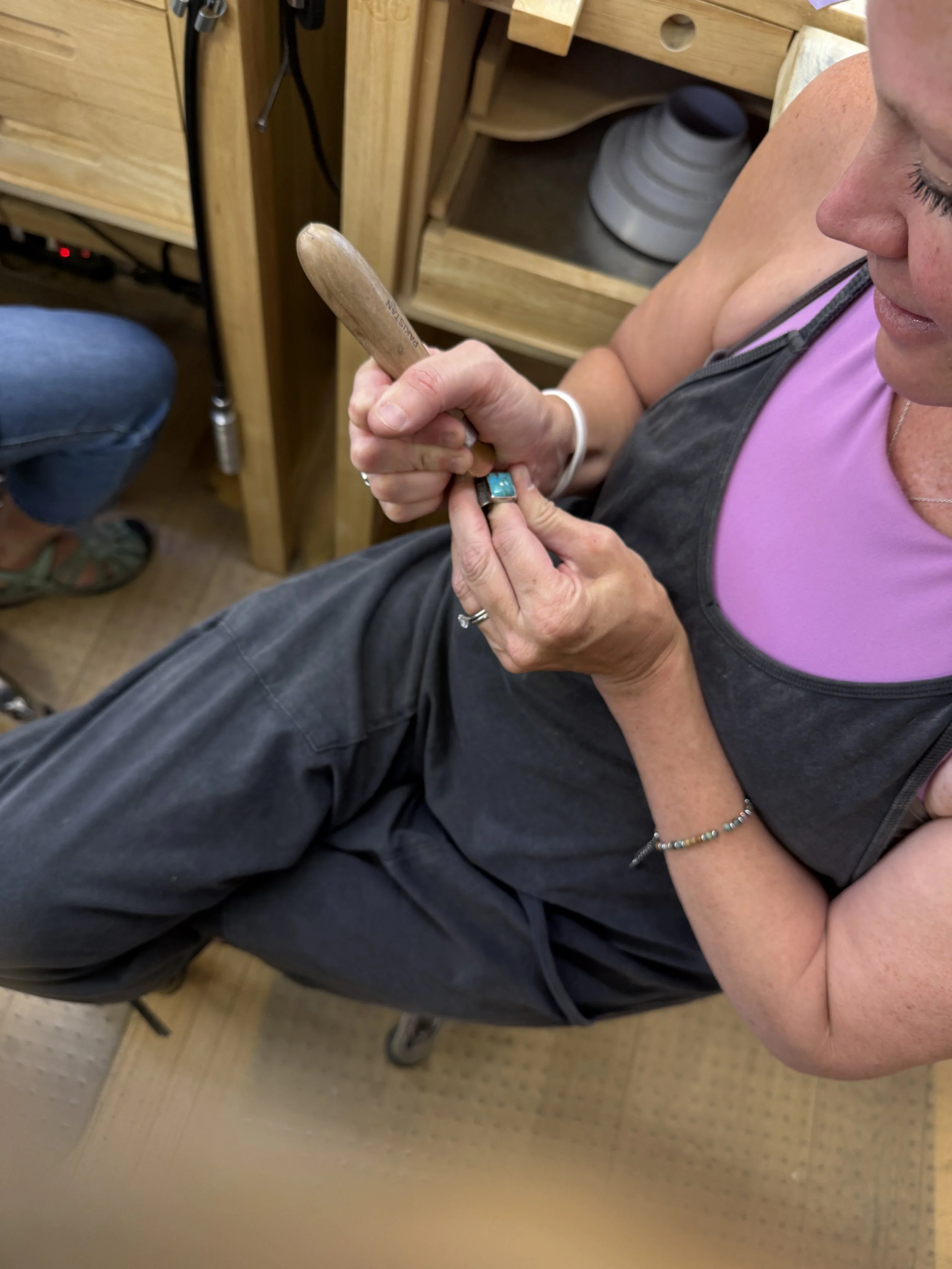 Turquoise ring class Albuquerque featuring a student handcrafting a turquoise ring.