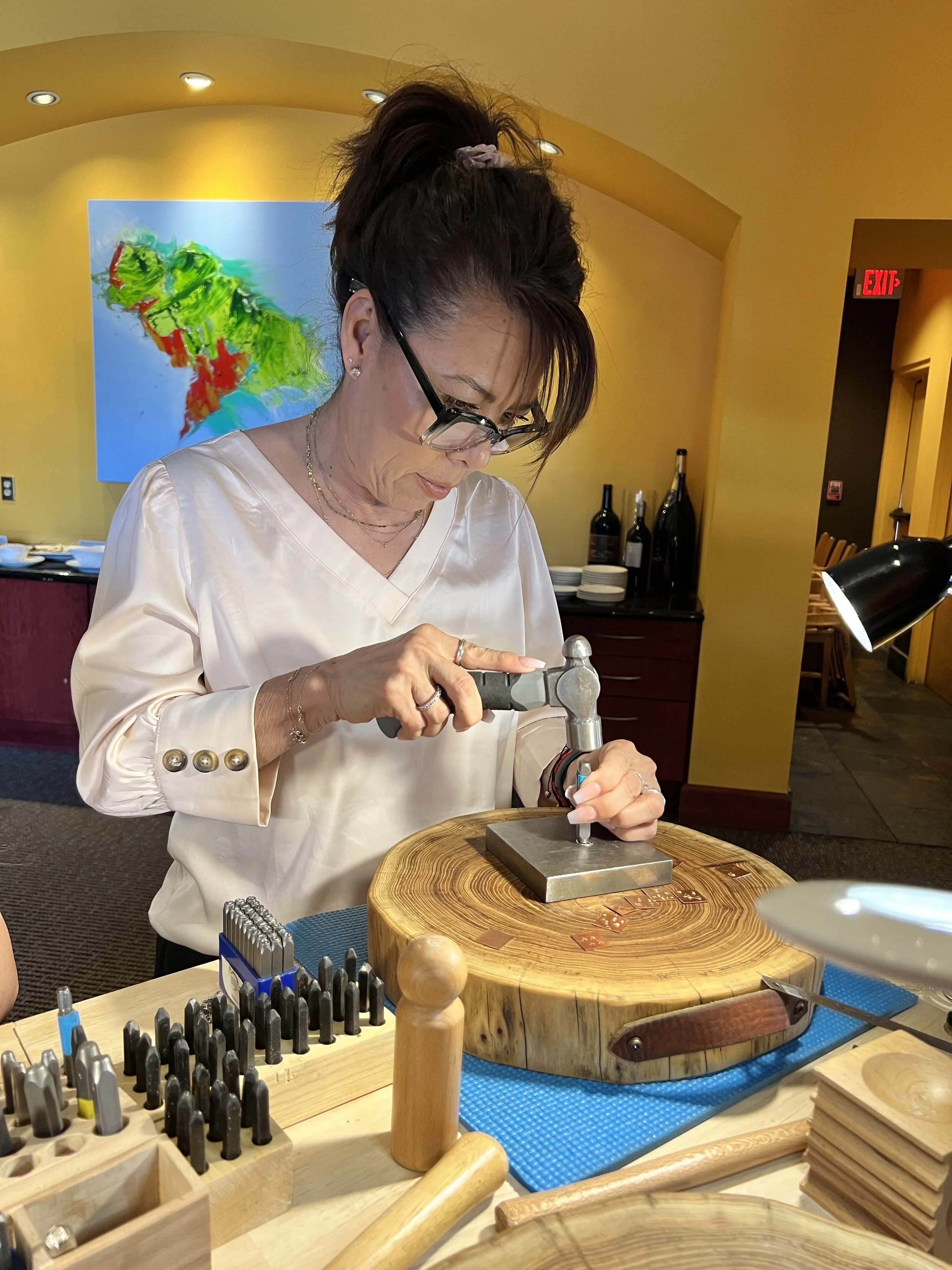 Jewelry workshop in Albuquerque with a participant crafting.
