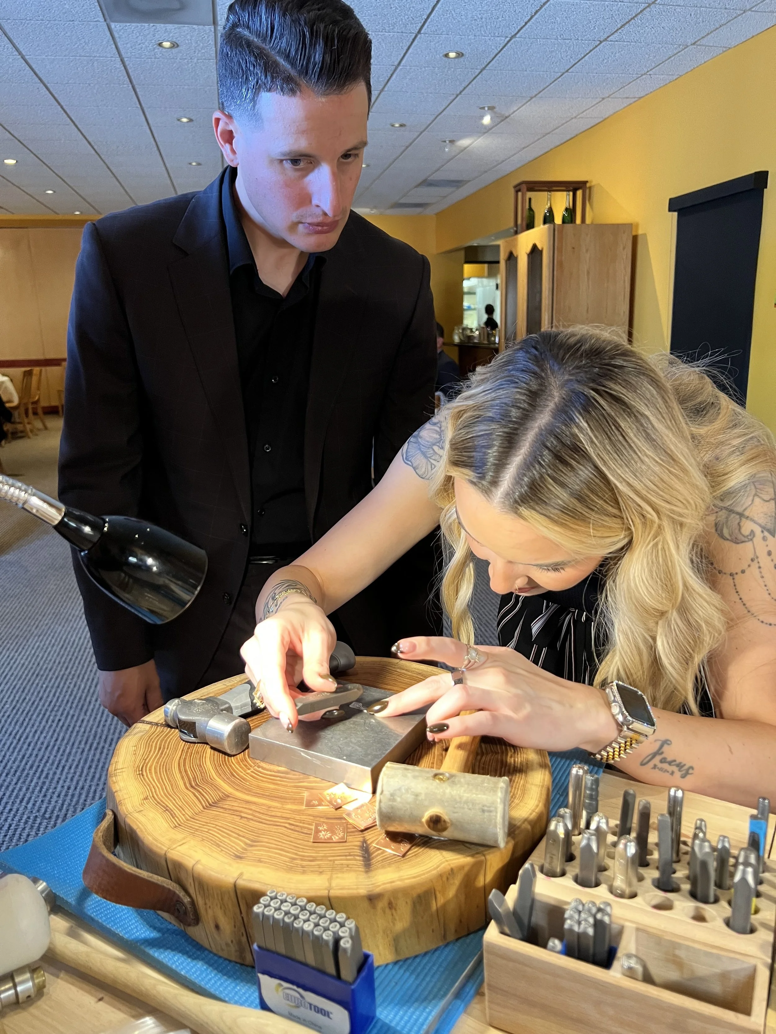 Jewelry workshop in Albuquerque with people making jewelry.
