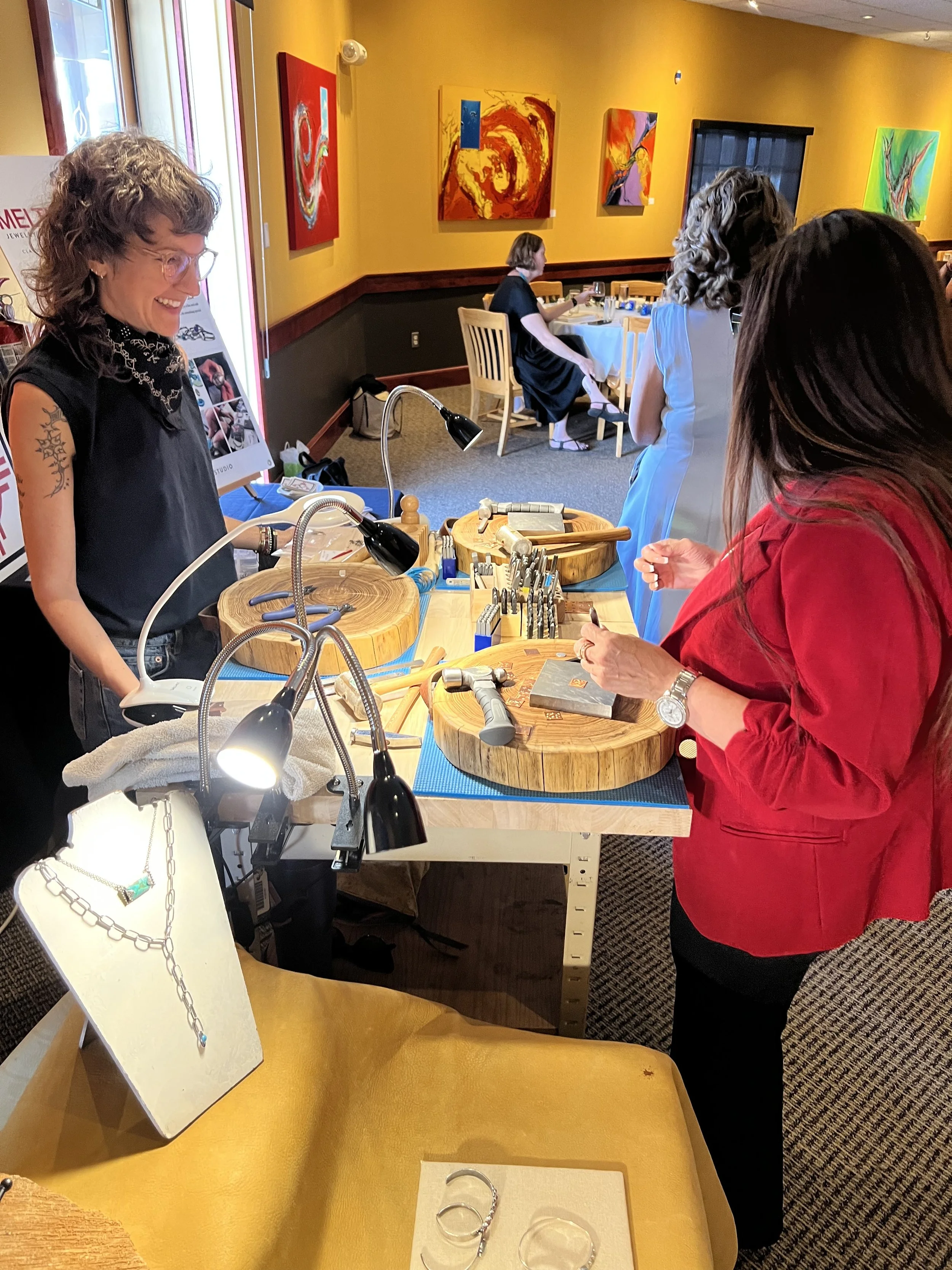 Jewelry workshop in Albuquerque with participants learning.