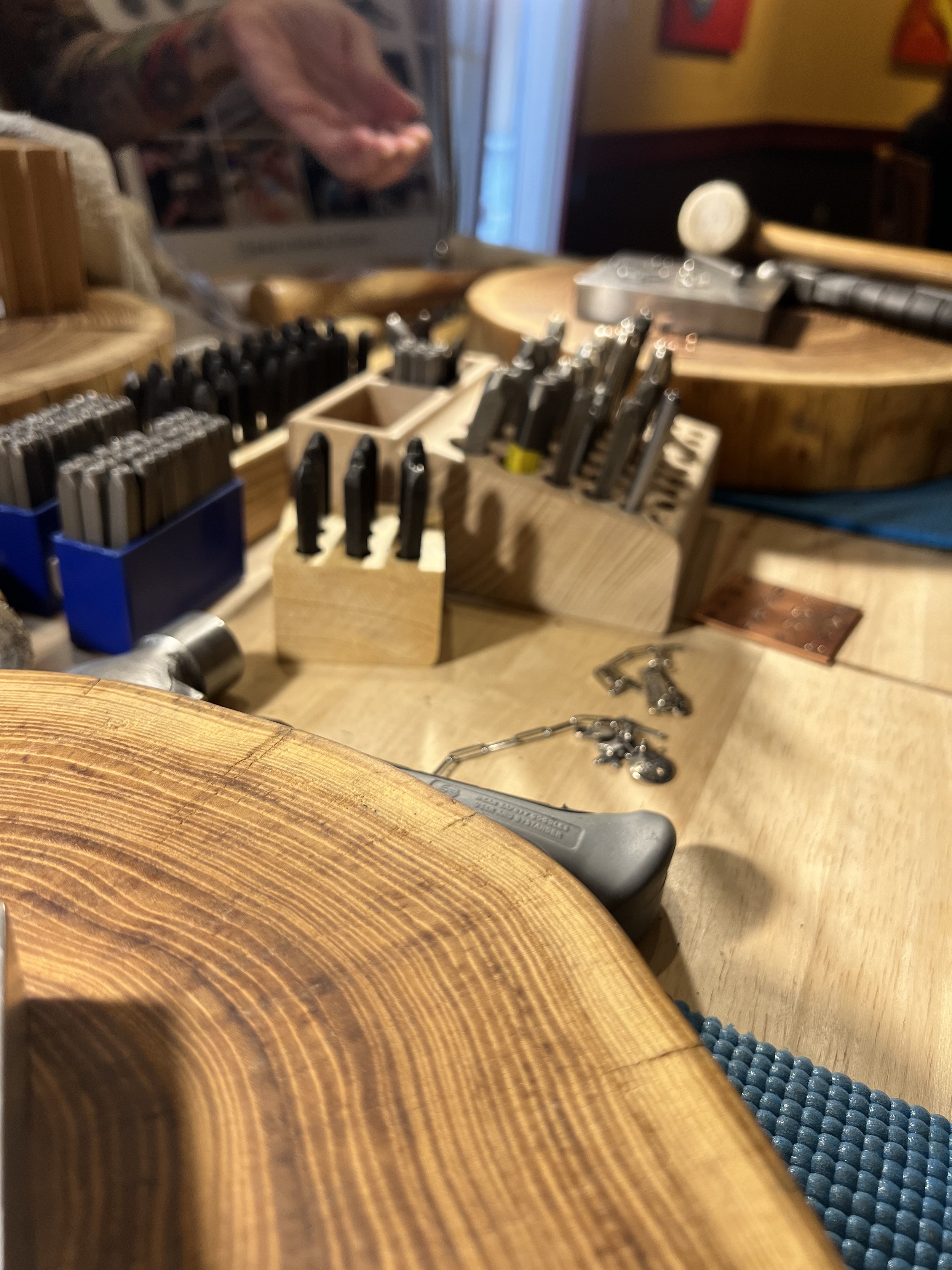 Jewelry workshop in Albuquerque with tools and materials.