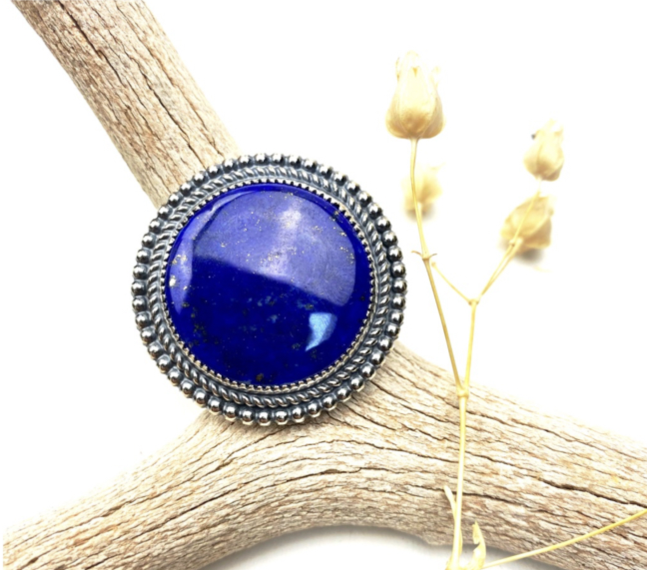 Handmade sterling silver ring featuring a blue lapis lazuli stone