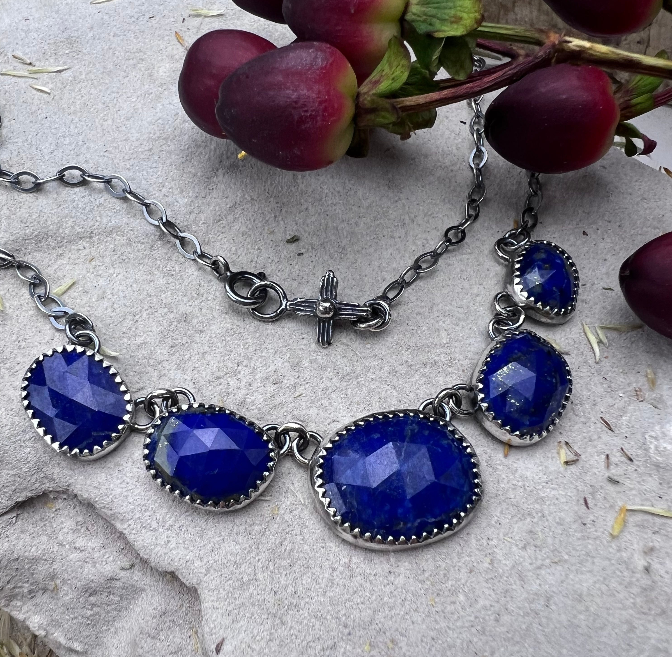 Handmade sterling silver necklace set with a blue lapis lazuli stone