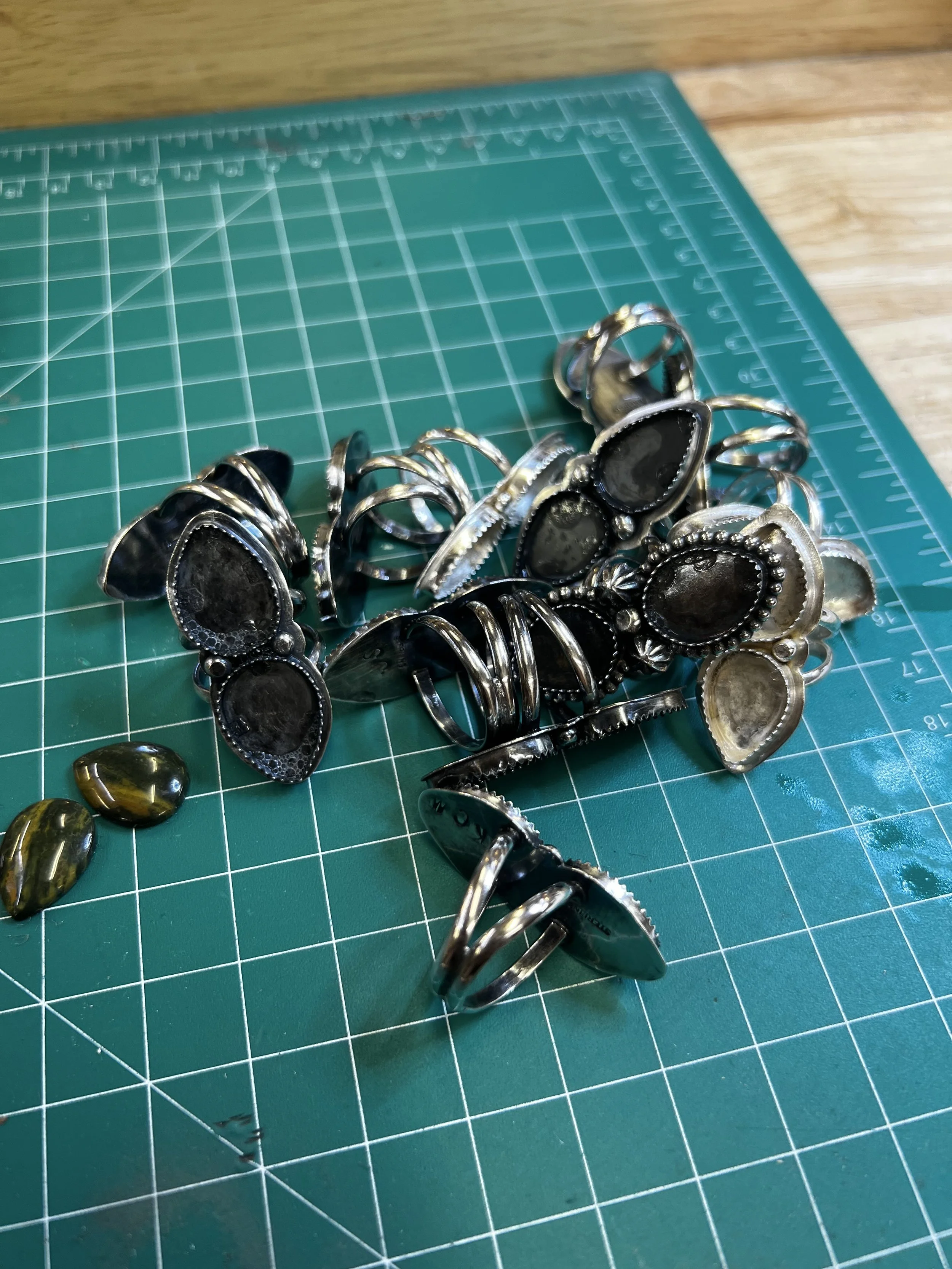Finished rings and gemstone settings from the jewelry making class